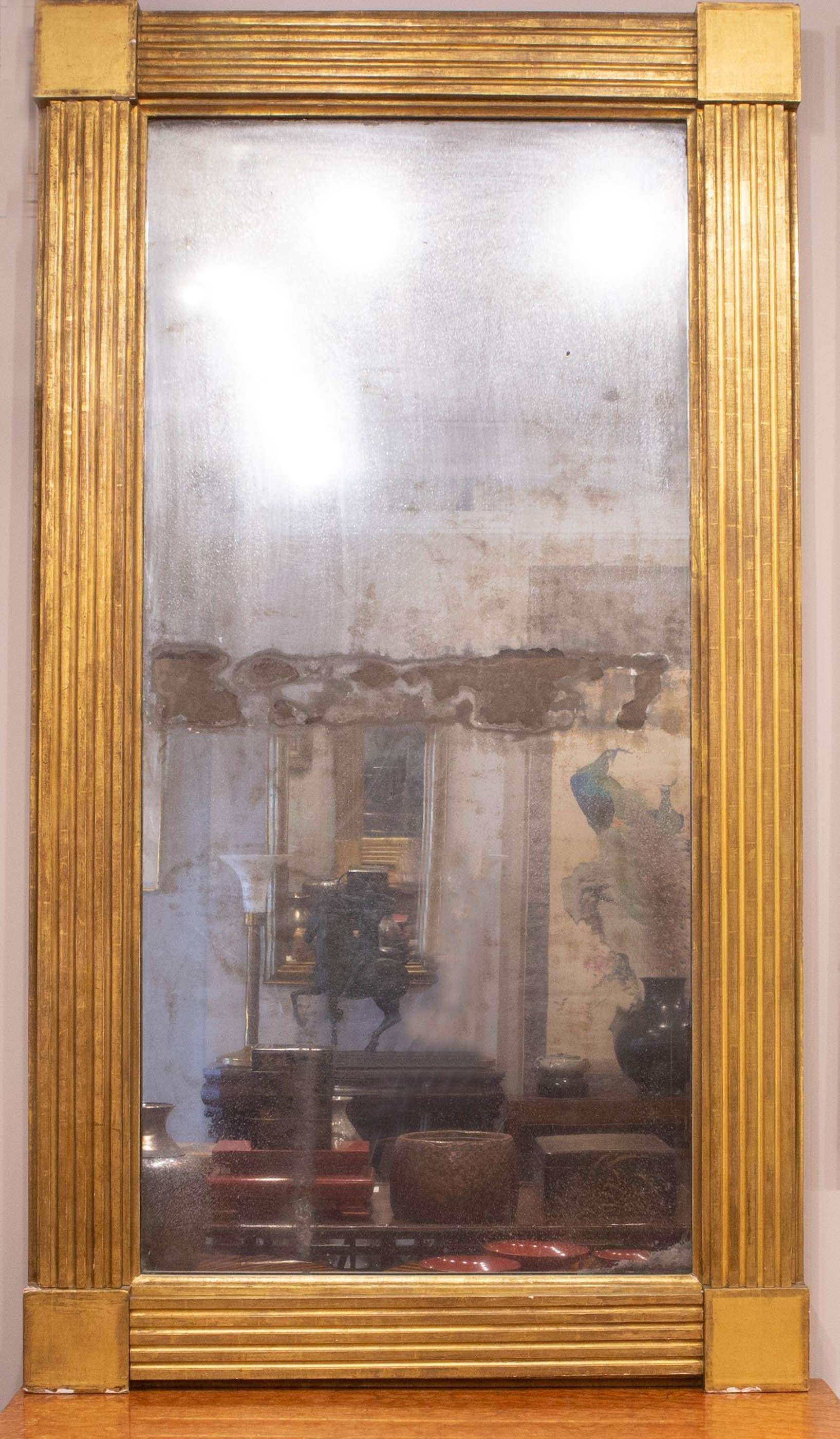 Mirrors are from circa 1825-1835 and were made in either New York or Boston. Both mirrors come with their original glass and wood backing. Sold as is, as a pair (one mirror panel has a crack in the upper left hand corner- as shown in photograph).