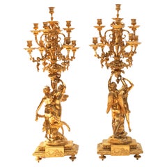 Pair of Large Gilt Bronze Louis XVI Style Candelabras Featuring Zephyr and Psych