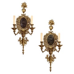 Coppia di grandi appliques in bronzo dorato