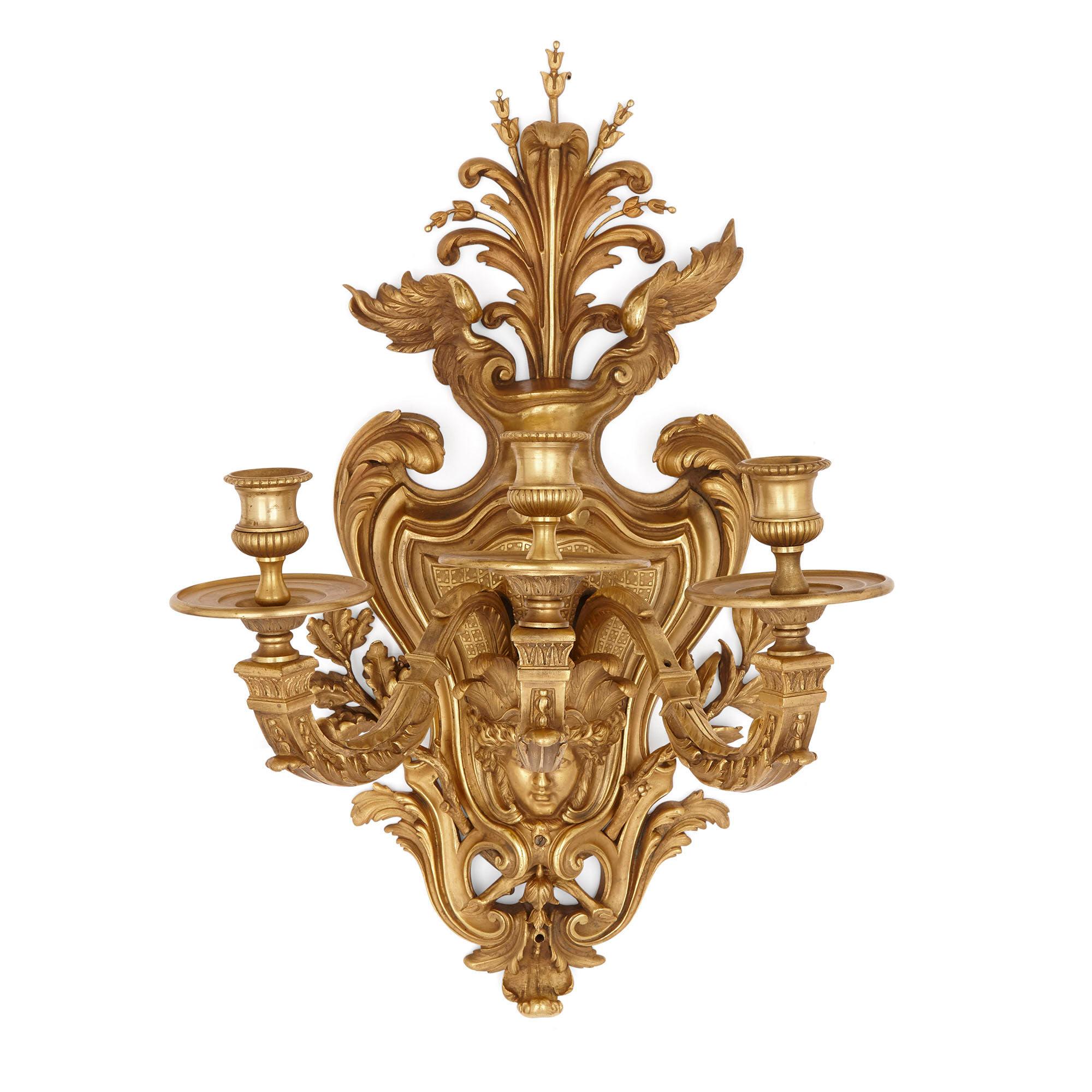 Pair of large gilt bronze sconces in the Régence style
French, circa 1880
Measures: Height 77cm, width 52cm, depth 40cm

This superb pair of gilt bronze sconces is wrought in the Régence style, evincing qualities of both the Baroque and the