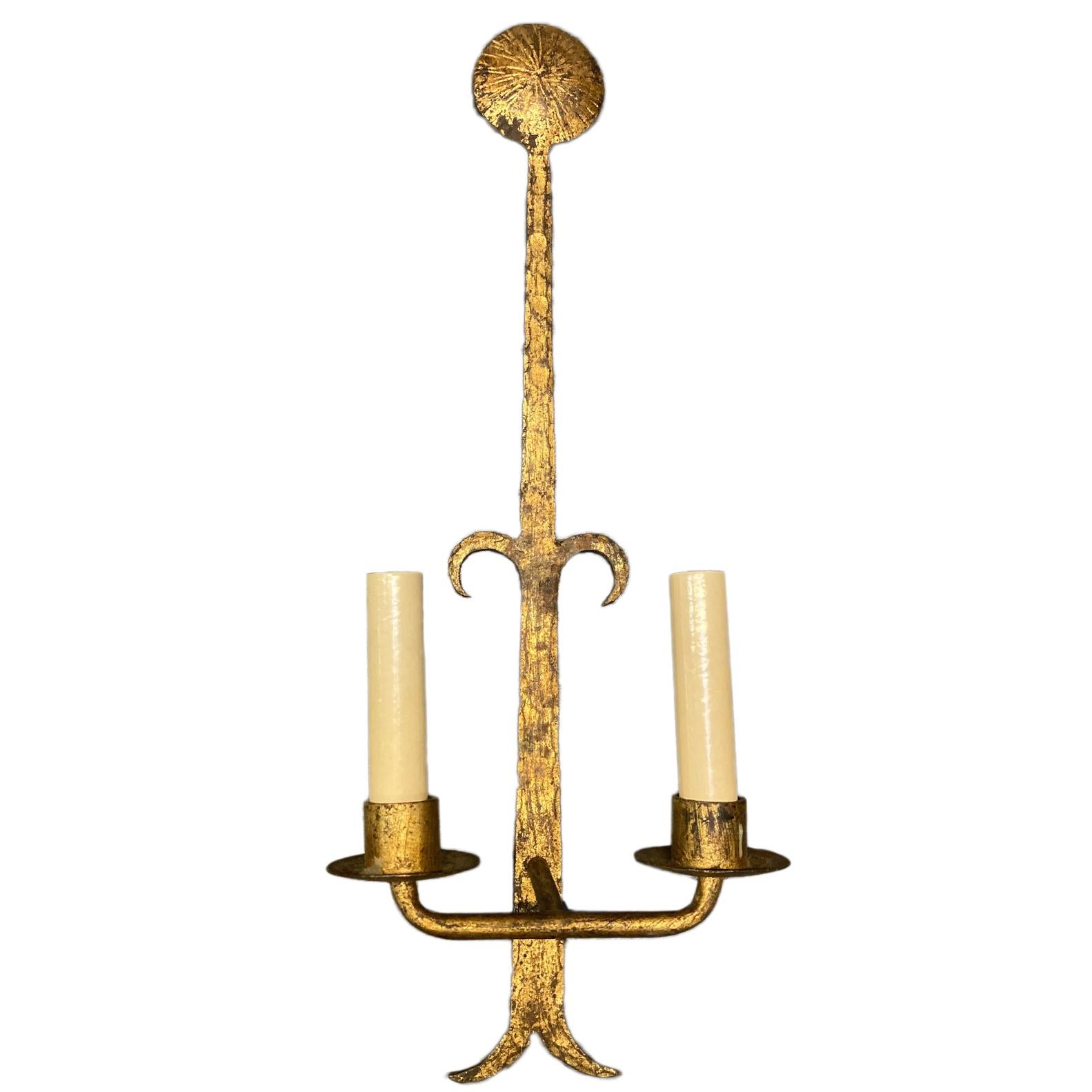 A pair of circa 1950s hammered and gilt iron two-light sconces with an original gilt finish.

Measurements:
Height 22