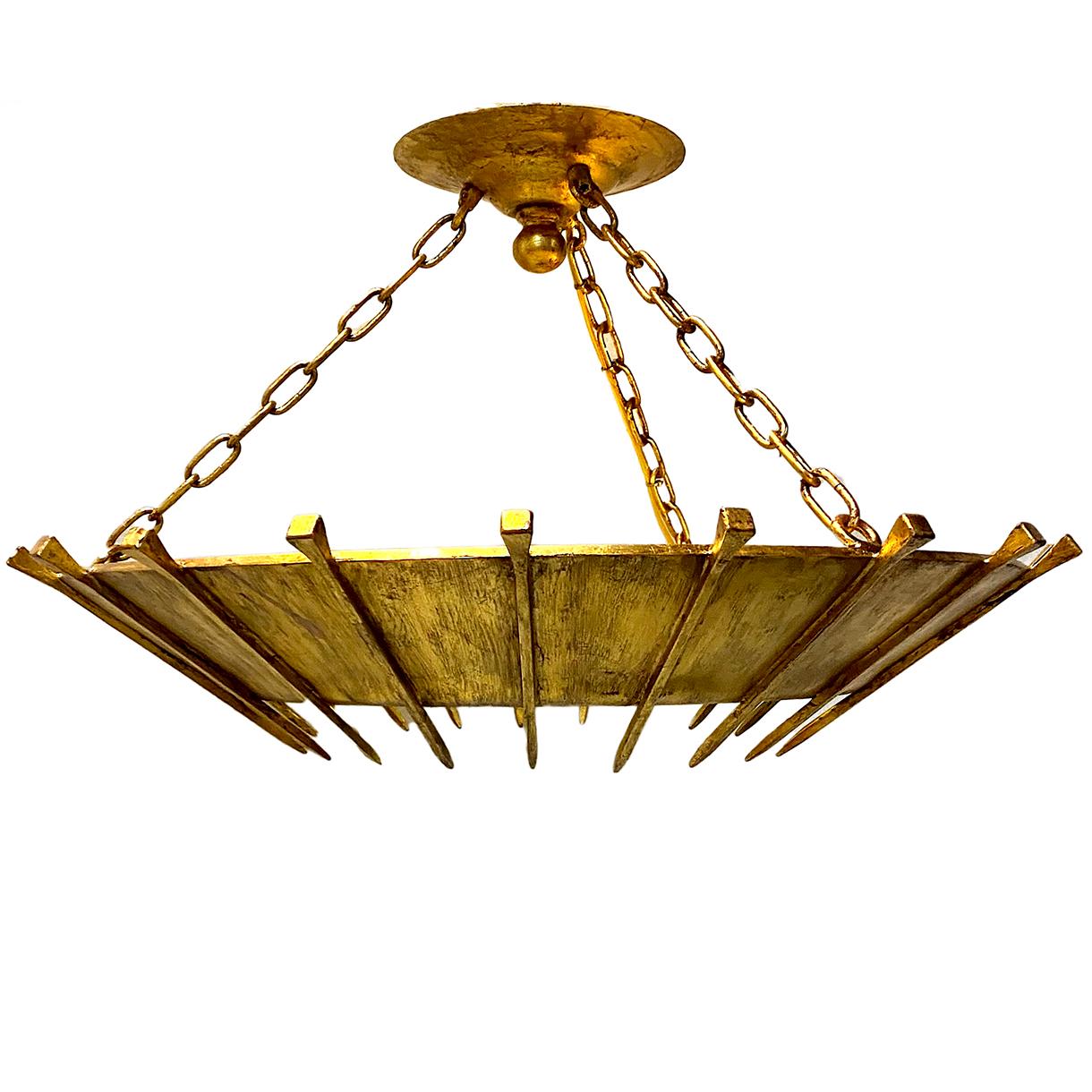 Pair of circa 1950s gilt metal light pendant light fixtures with nail details on body, glass inset and four interior lights. Sold individually.

Measurements:
Diameter 26
