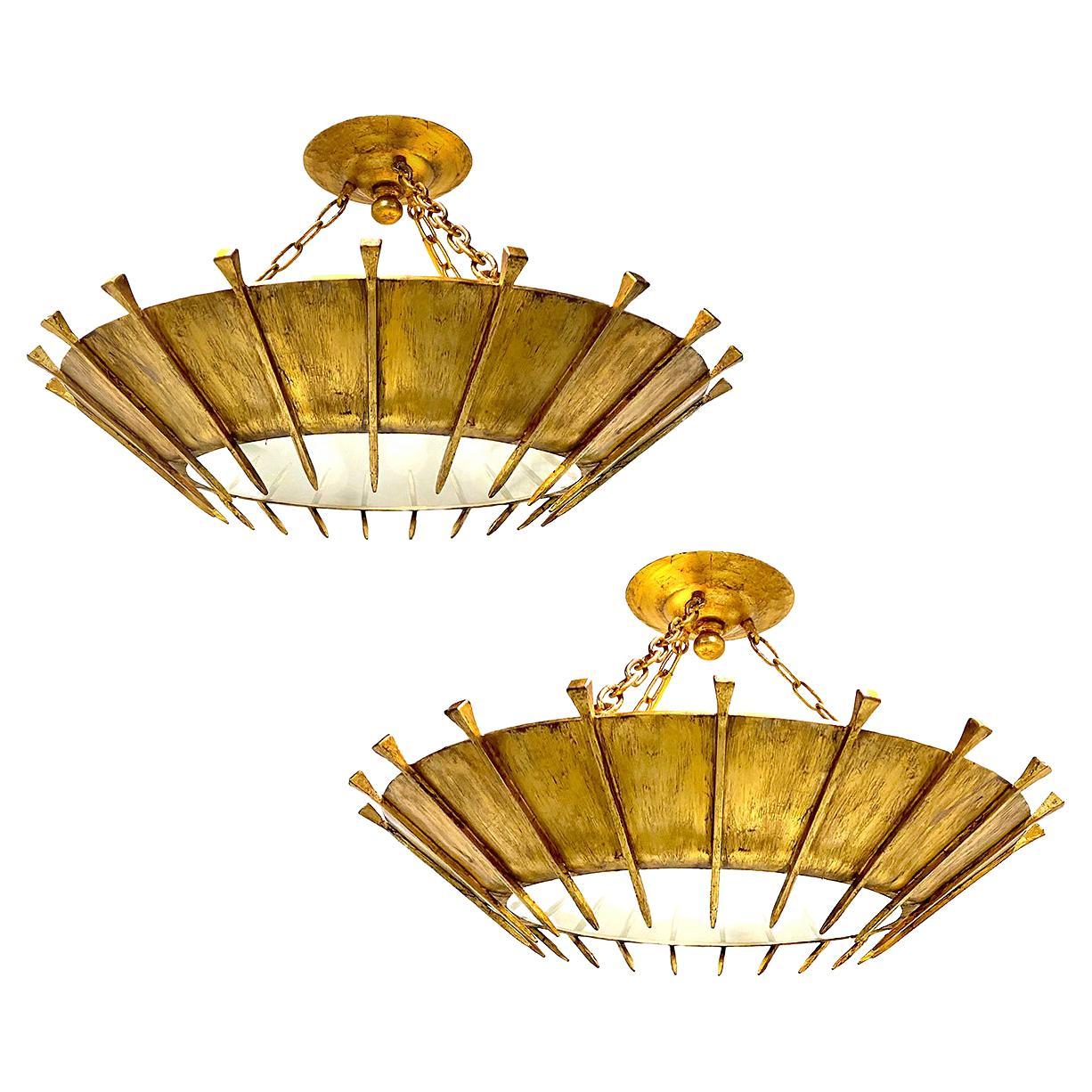 Paire de grands luminaires Sunburst en métal doré, vendus individuellement