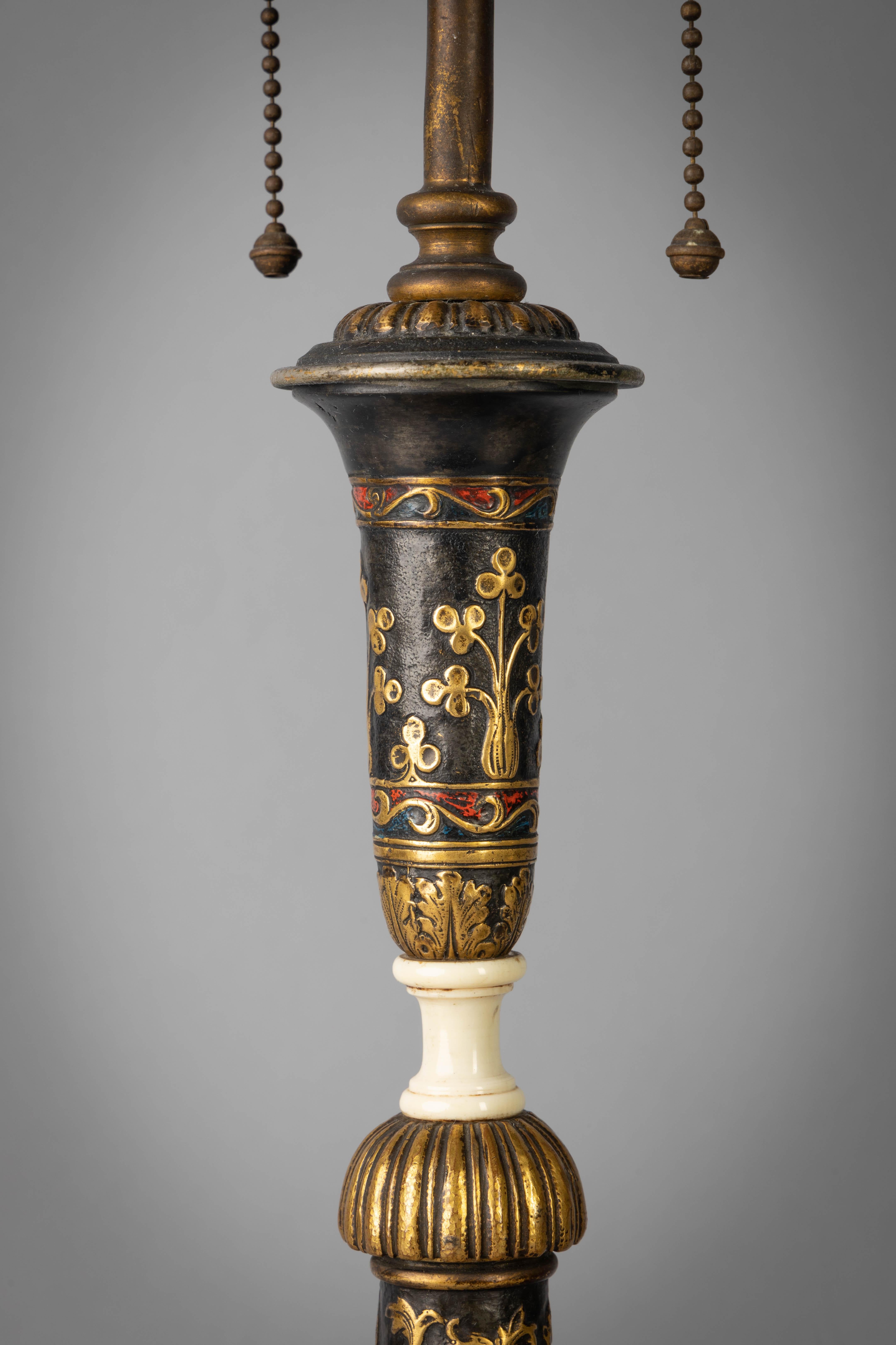 Pair of large gilt, patinated and enameled bronze candlestick lamps, E.F. Caldwell, circa 1900

In renaissance style with kings and queens at various pursuits amidst interlacing scroll and foliage decoration.