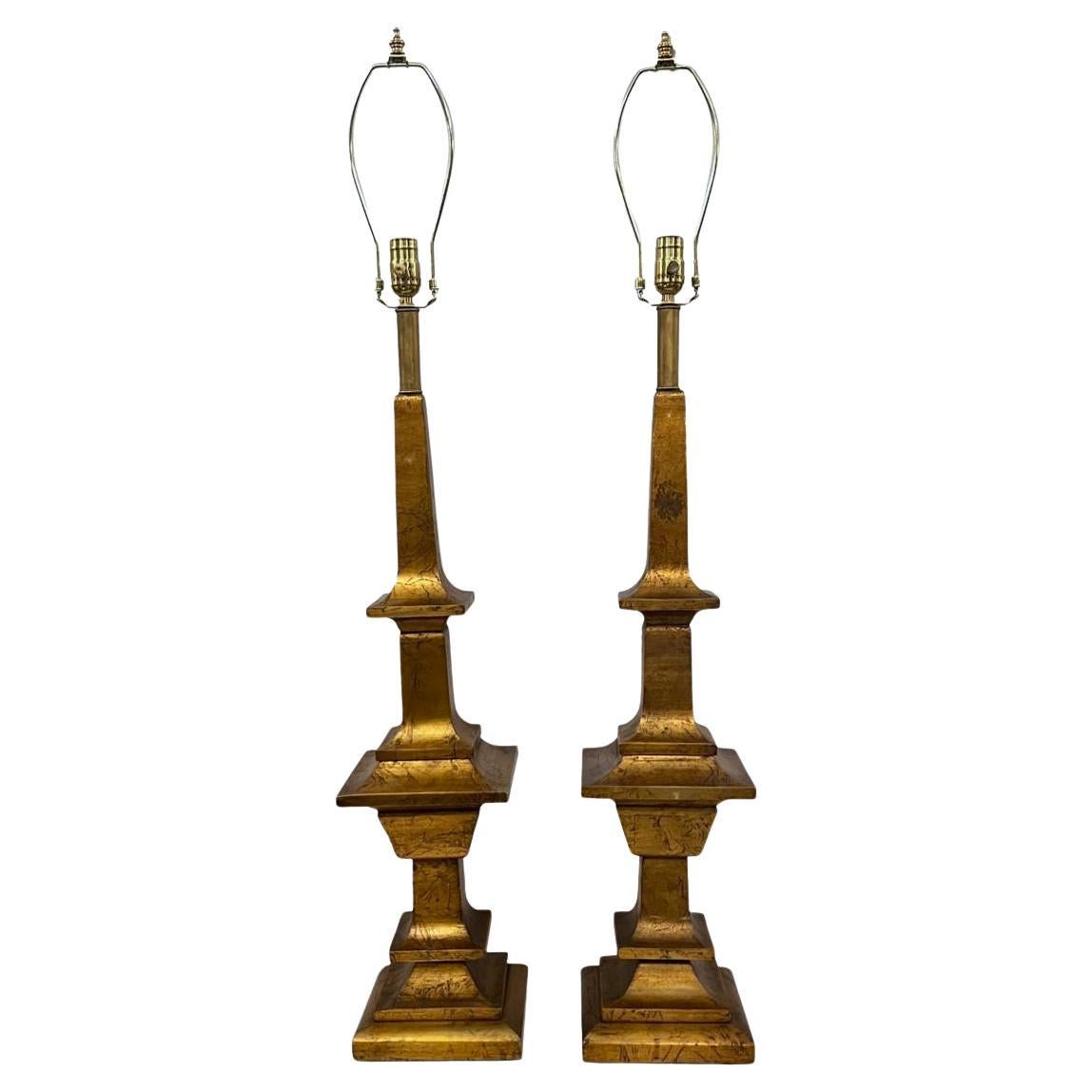 Coppia di grandi lampade in legno dorato