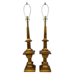 Coppia di grandi lampade in legno dorato