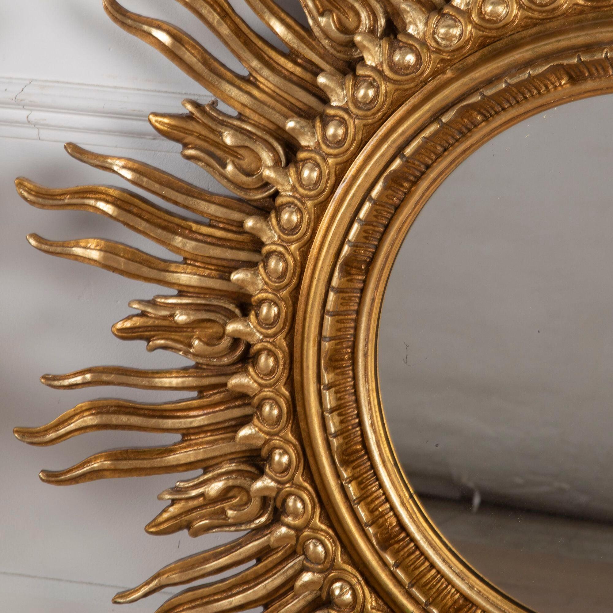 Stunning pair of 20th century hand-carved giltwood sun mirrors.
Made on two tiers with an original glass plate by Francisco Hurtado, Valencia, Spain circa 1950-1960.
With its original maker's label on the back of both. Unusual to find individually