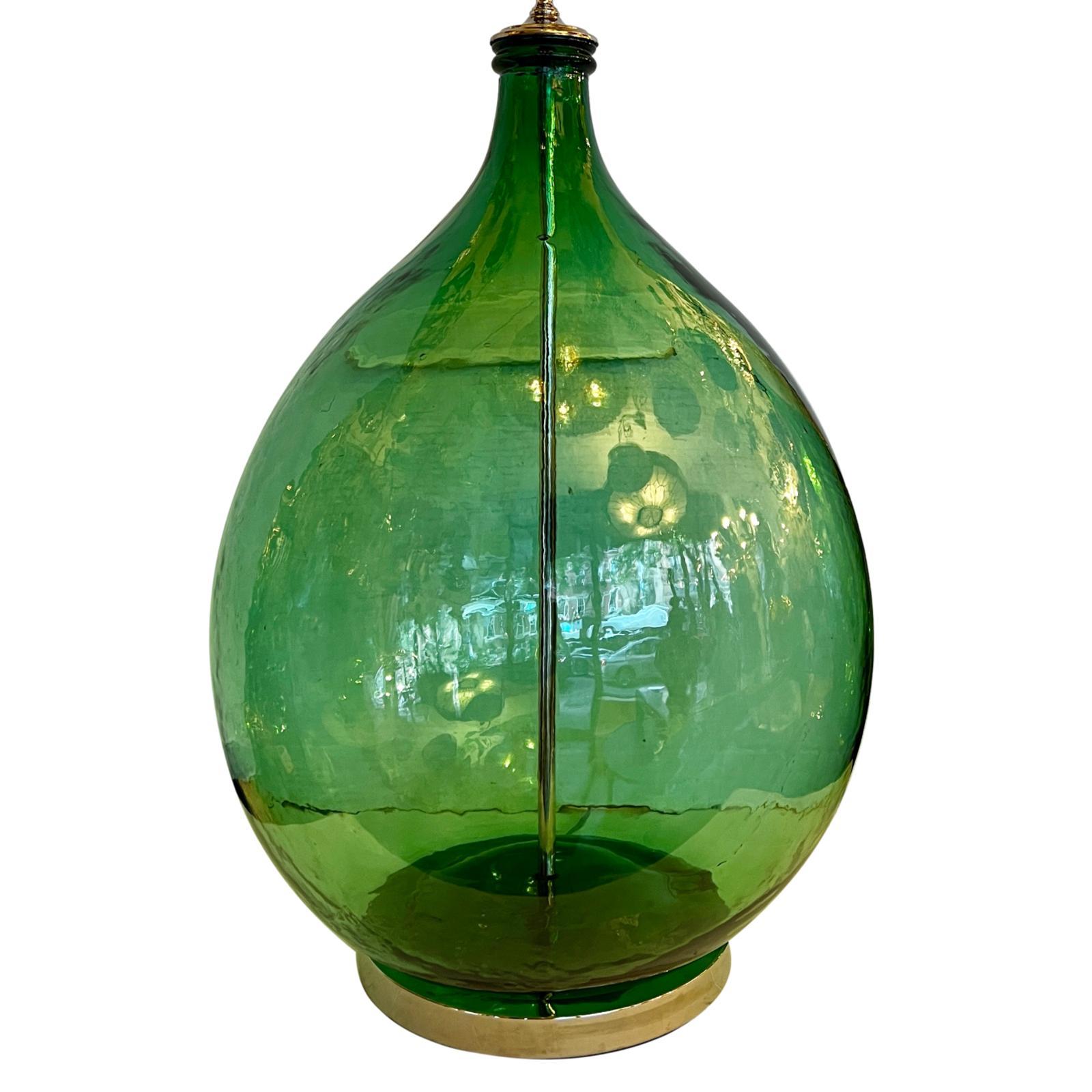 A pair of large circa 1930s Italian blown glass bottle table lamps.

Measurements:
Height of body: 27