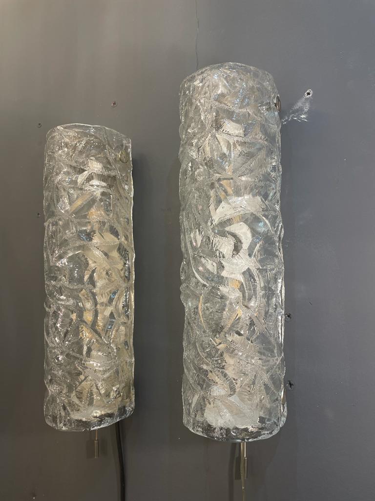Beautiful glass sconces or wall lights from the 1960s. The thick textured glass creates a wonderful light effect. The sconces are in excellent condition.
We recommend that electric fittings should be checked locally by a specialist concerning local