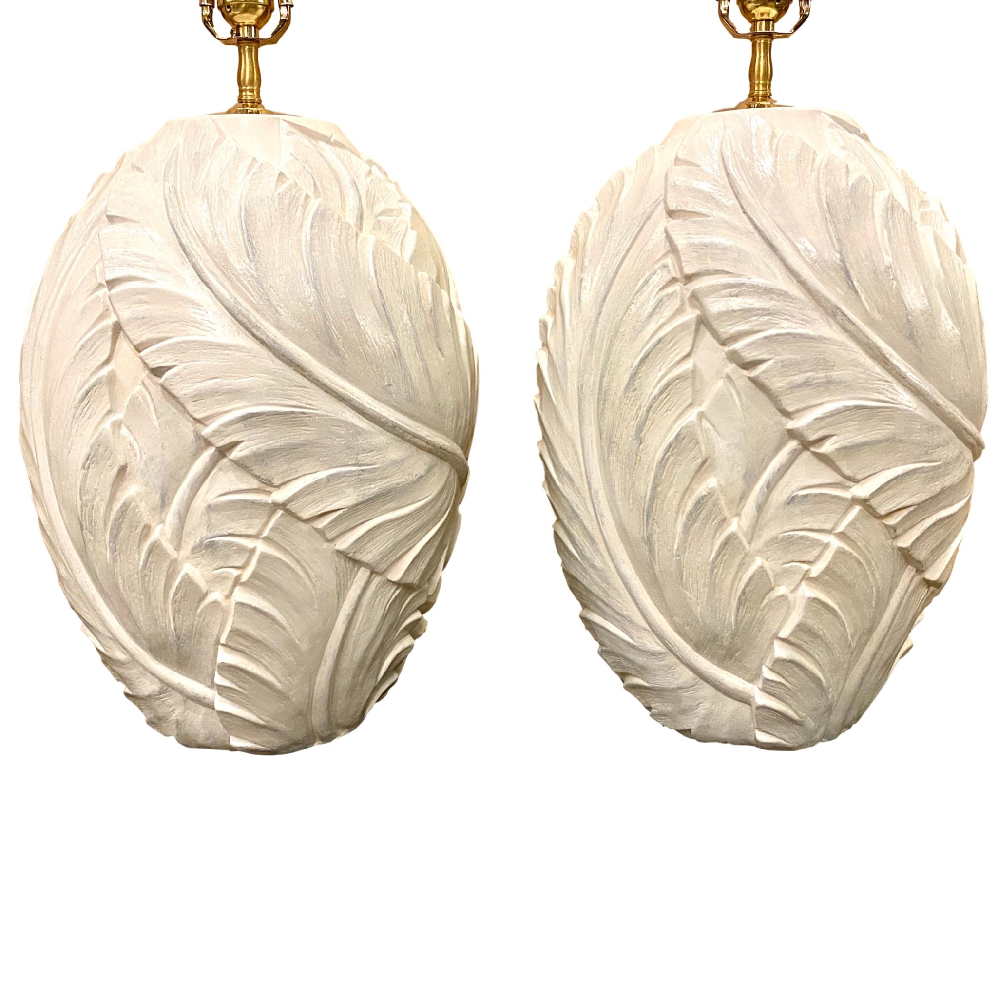 A pair of large circa 1960s French glazed plaster table lamps leaf motif in relief.

Measurements:
Height of body 17