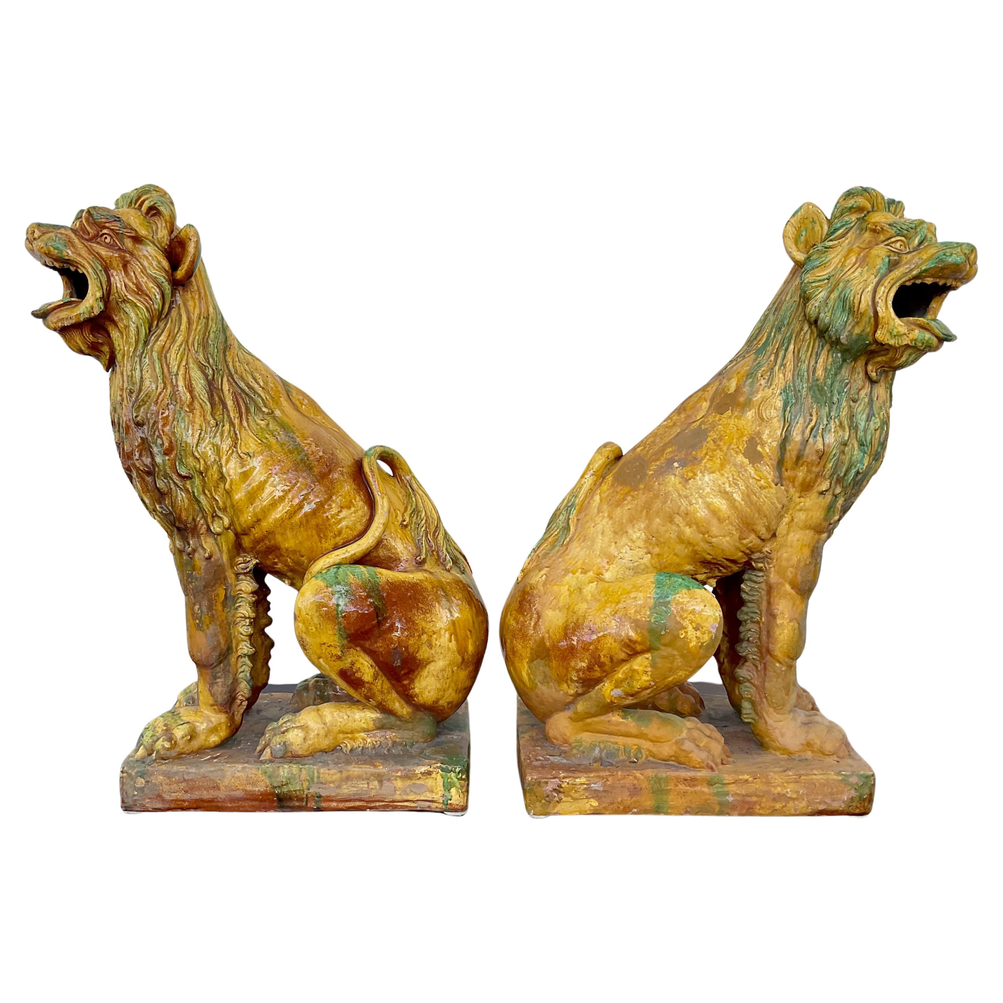 Pottery Pair of Large Glazed Terra Cotta Lions or Foo Dogs For Sale