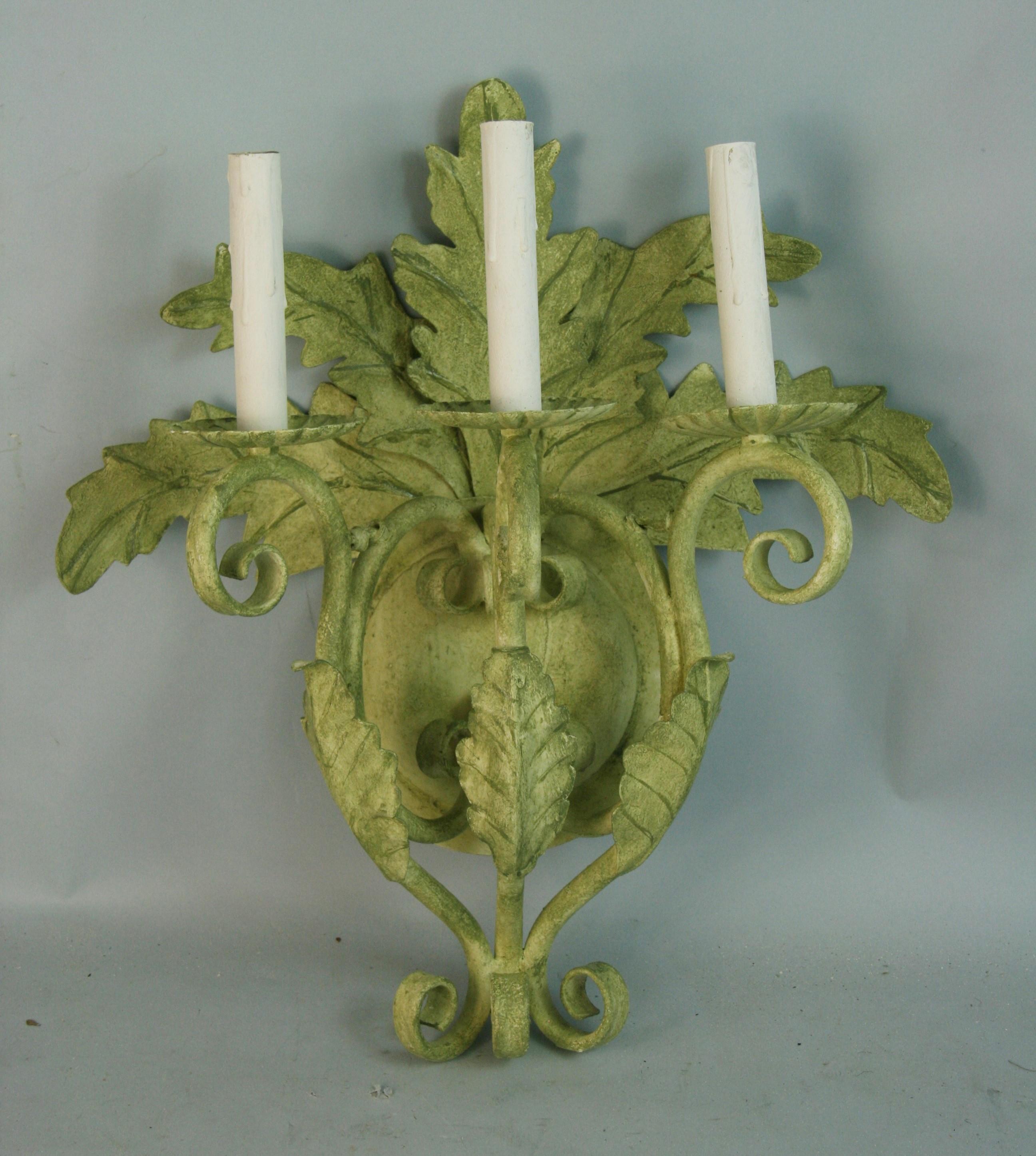 8-215 pair of large 3-light hand painted green palm frond  sconces
Takes 40 watt candelabra based bulbs.
