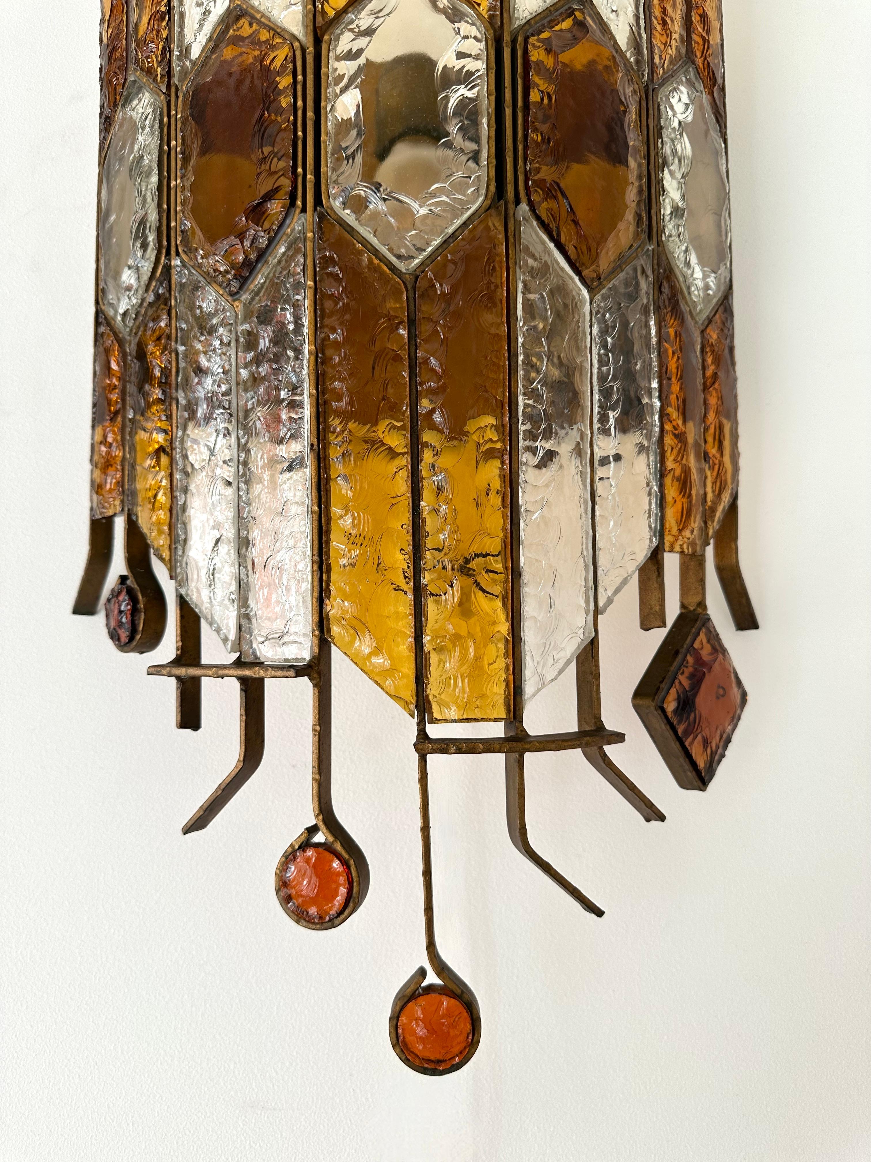Mid-Century Modern pair of large set of 2 wall lamps lights sconces amber, red and clear hammered glass and wrought iron, gilding gold copper patina, by the manufacture Longobard in Verona in a Brutalist style, the concurrent of Biancardi Jordan