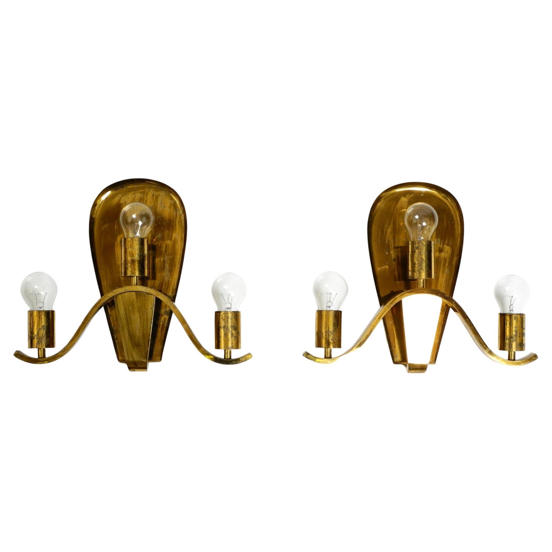 Pair of large heavy Mid Century brass wall lights from a German church