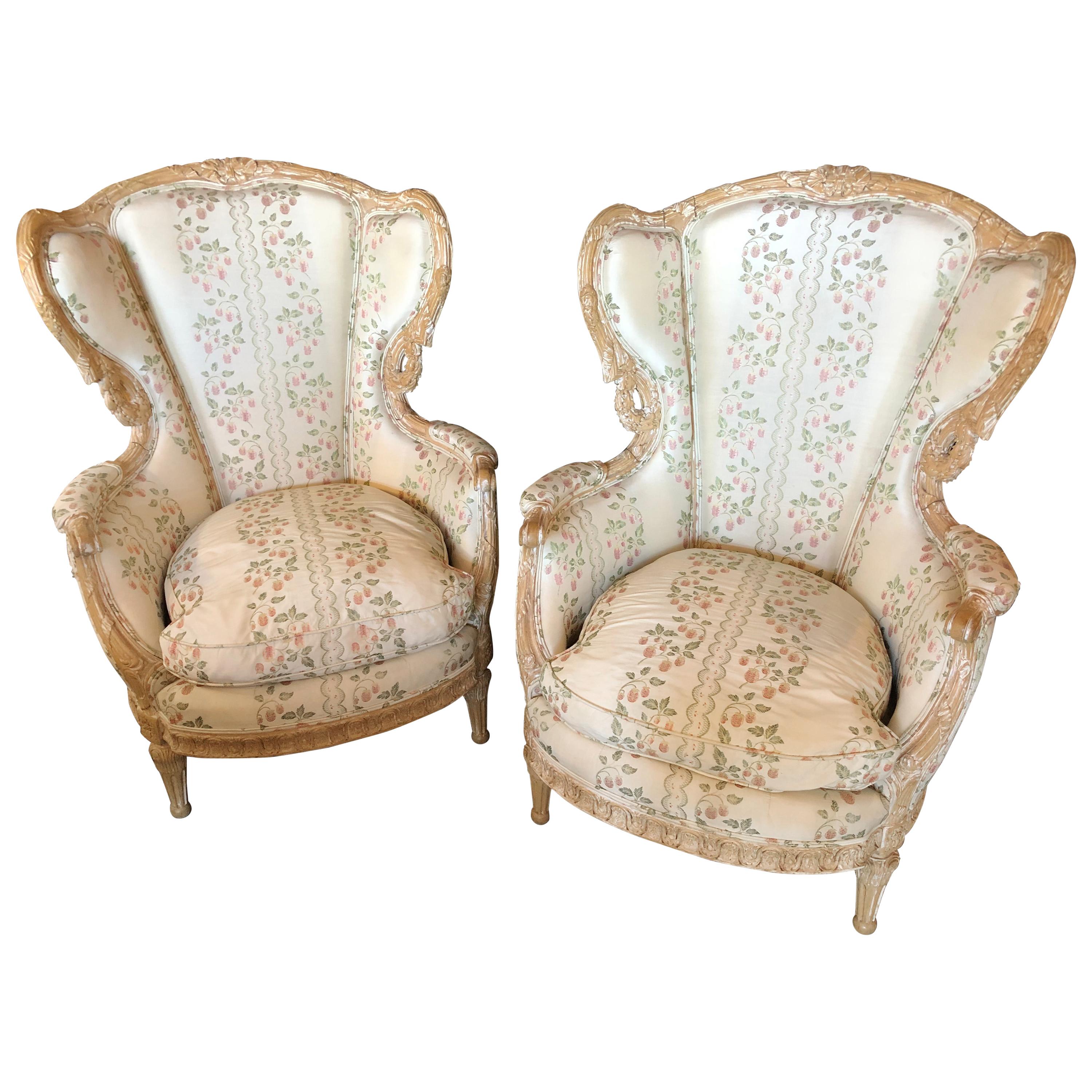 Pair of Large Impressive High Back Distressed Carved Framed Wing Back Armchairs For Sale