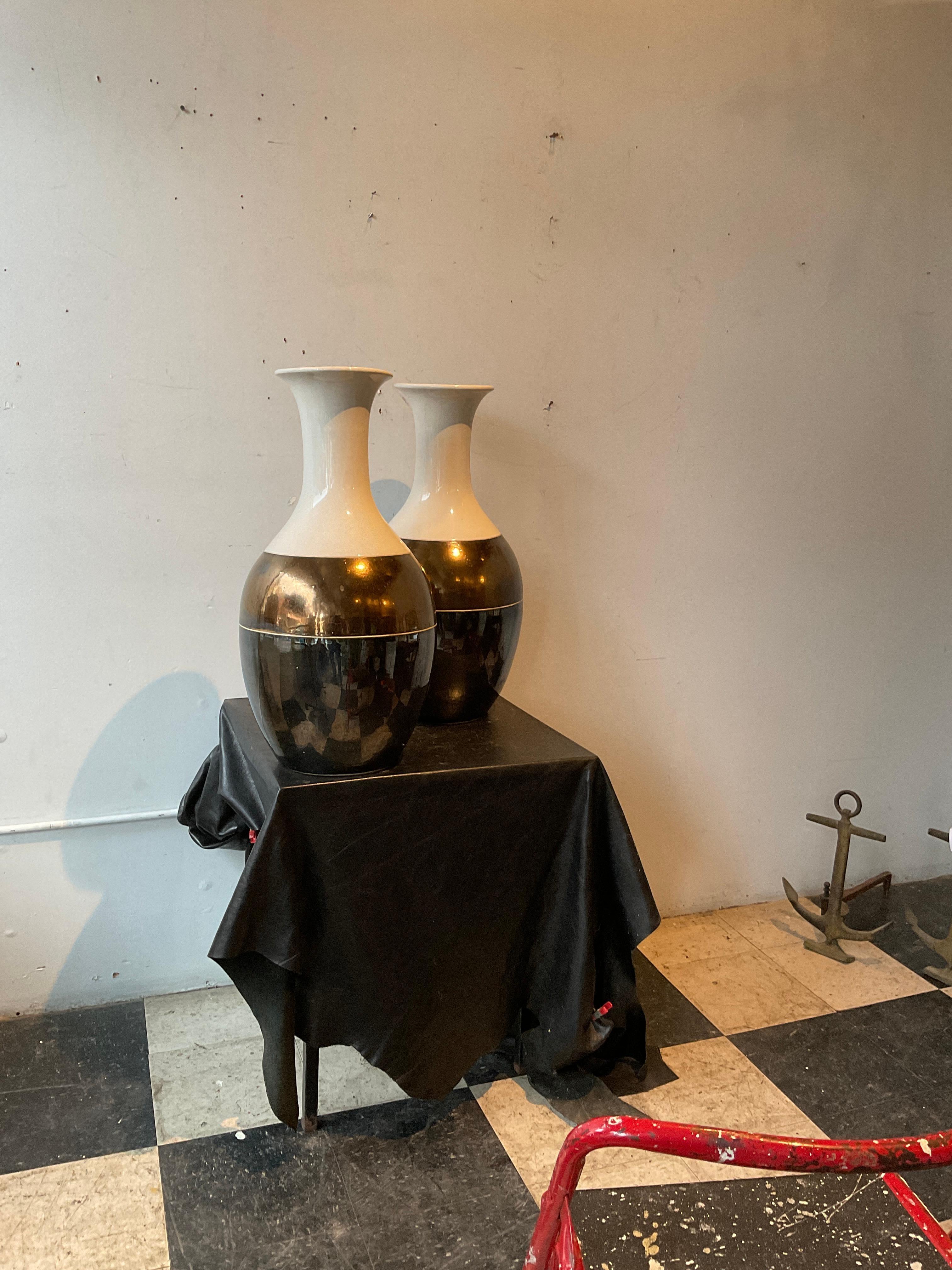 Pair of Interlude ceramic vases in a metallic finish.
