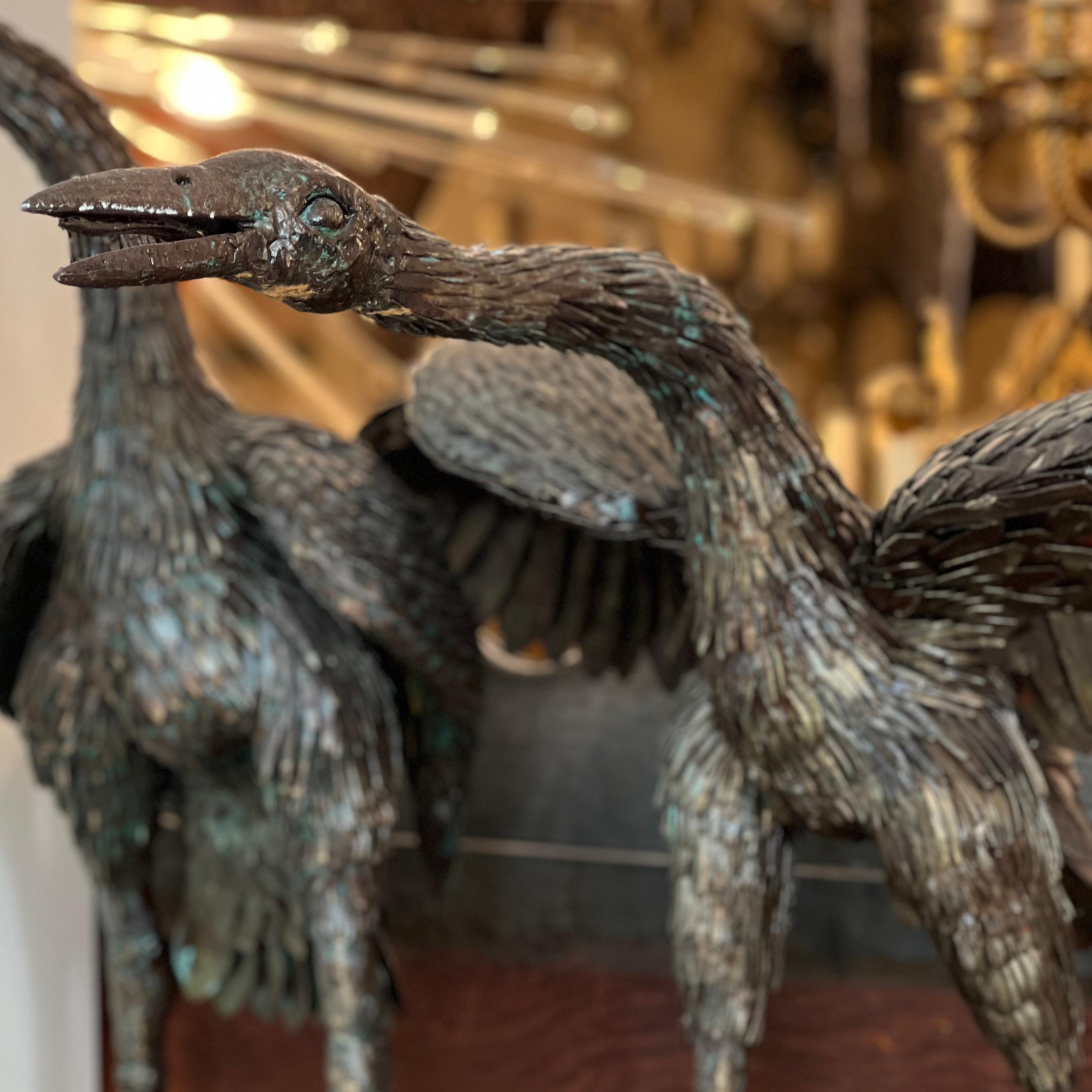 Pair of 1940s Italian hammered iron sculptures depicting two cranes. Original finish and patina.

Measurements:
Height: 34