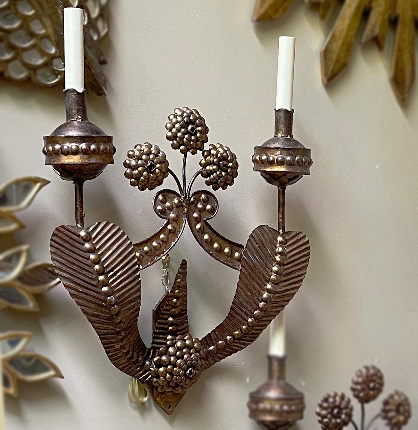 A pair of large circa 1940's Italian gilt iron double light sconces with flower detail.

Measurements:
Height: 21