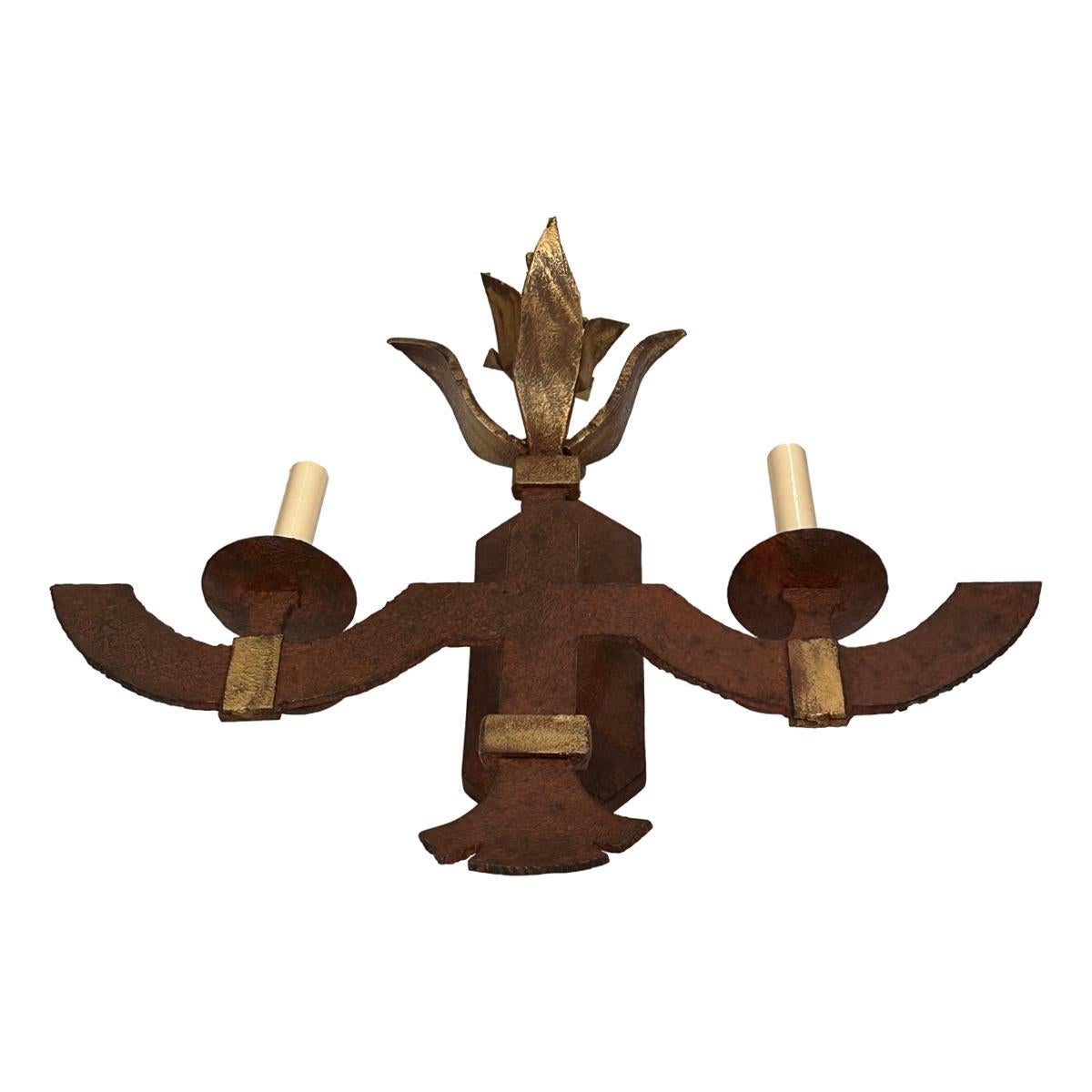 Pair of 1960's Italian iron sconces with gilt details.

Measurements:
Height: 19