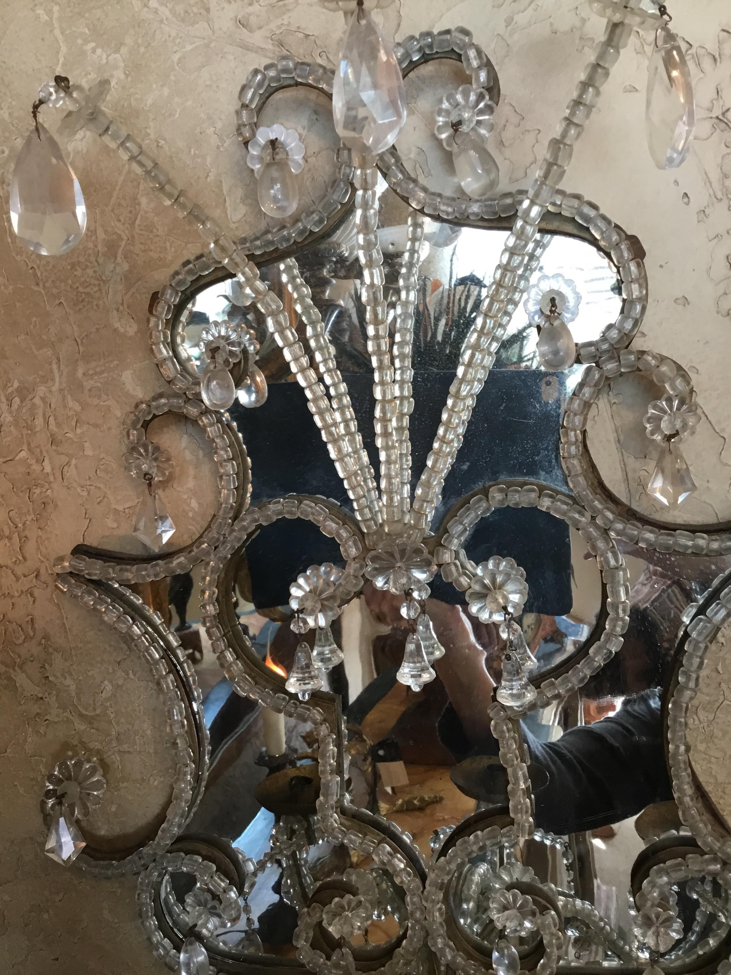 Impressive large and exquisite sconces for candles.
Early 19th century , beading and petite crystal bells adorn these
Beautiful sconces.