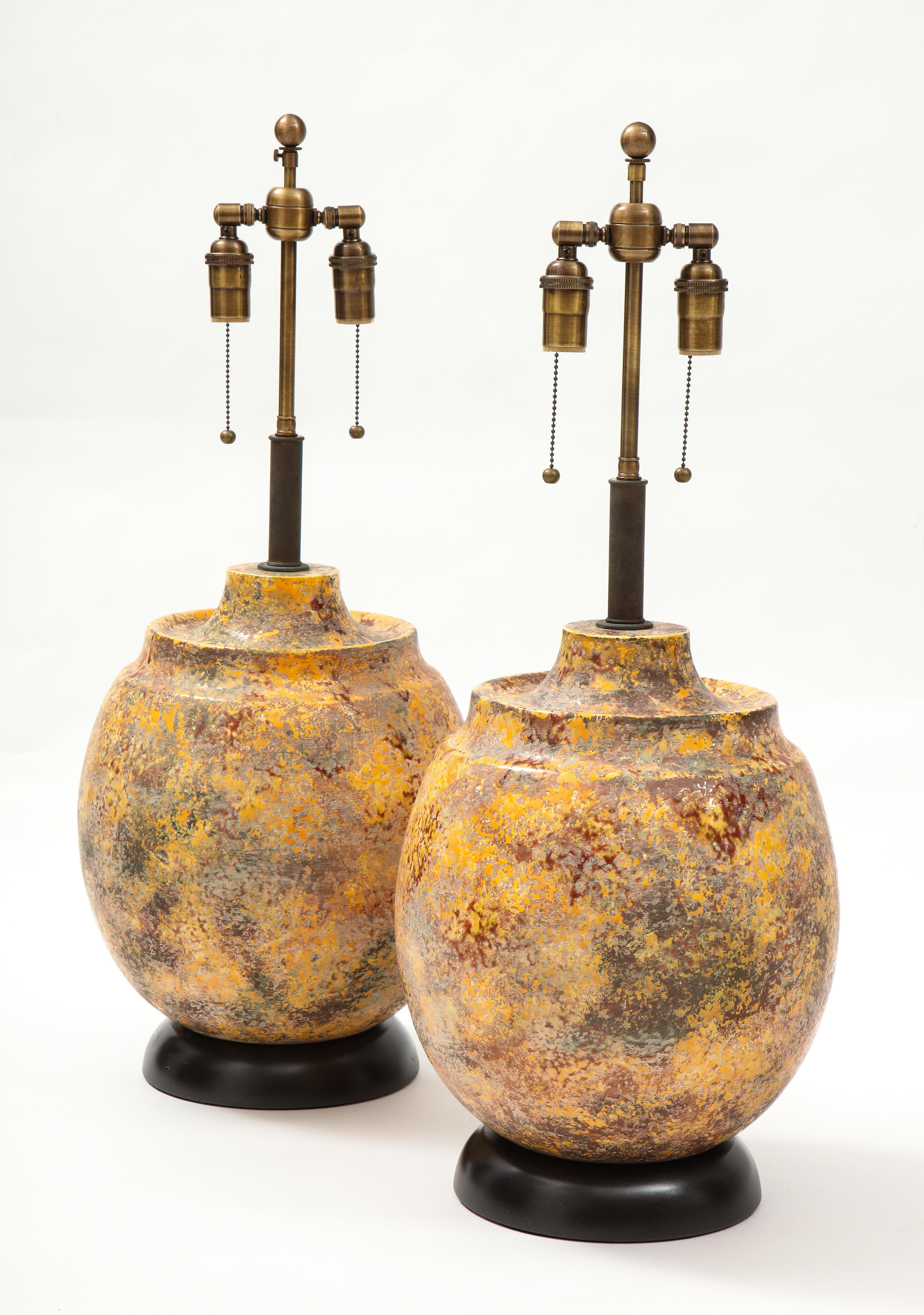 Wonderful pair of 1960's  large Italian ceramic lamps.
The vessel shaped lamps have a textured 