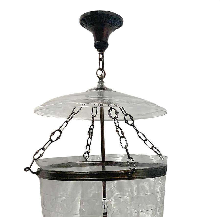 A pair of circa 1920's Italian foliage/floral etched glass lanterns with three interior lights and original smoke bell top. Sold individually.

Measurements:
Diameter: 18″
Current drop: 42