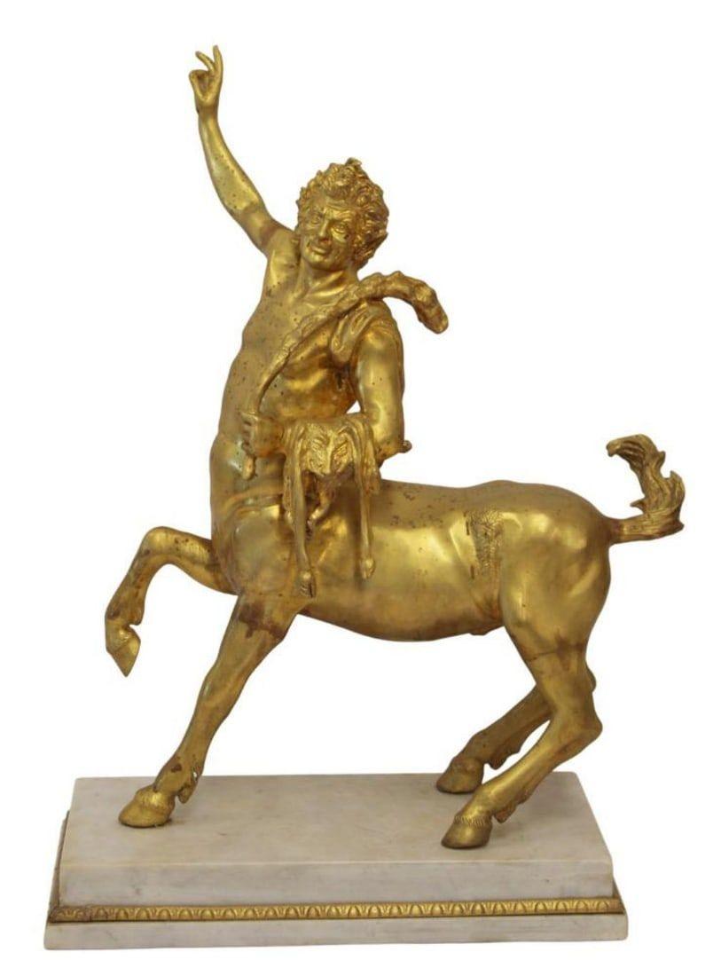Finely sculpted and cast gilt bronze castings of the Furietti Centaurs, mounted on rectangular plinths of white marble.  Each 23-24 inches tall and in good condition.

The Furietti Centaurs (known as the Old Centaur and Young Centaur) are a