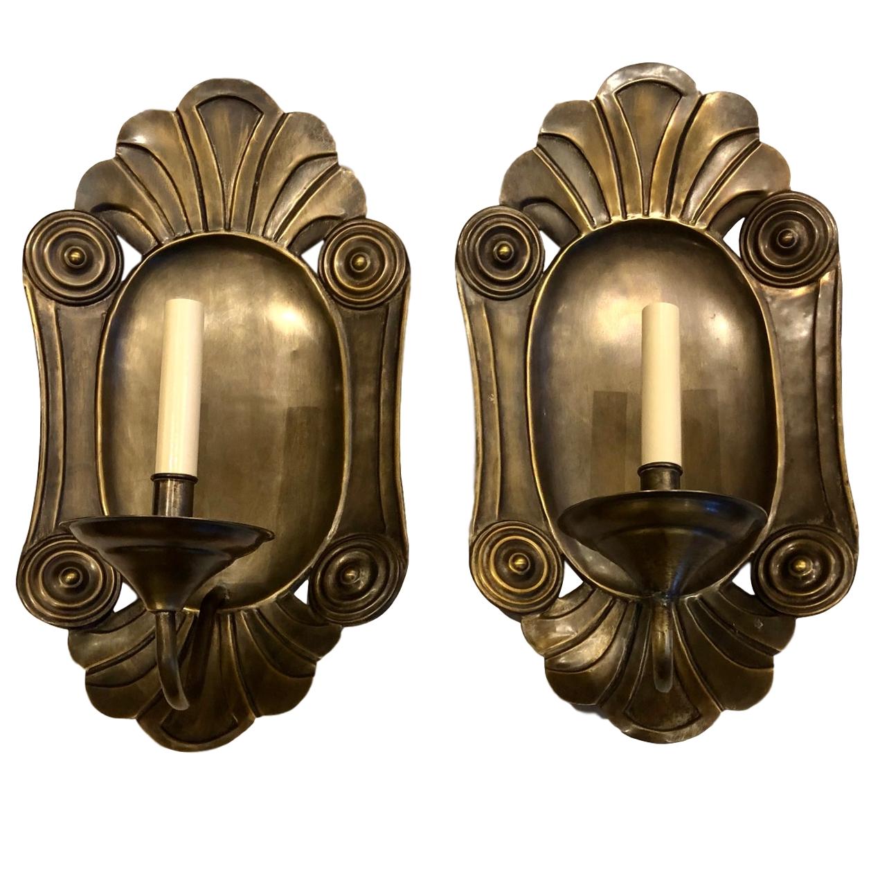 A pair of large circa 1940's Italian neoclassic style repousse' metal single-light sconces.

Measurements:
Height: 18.5