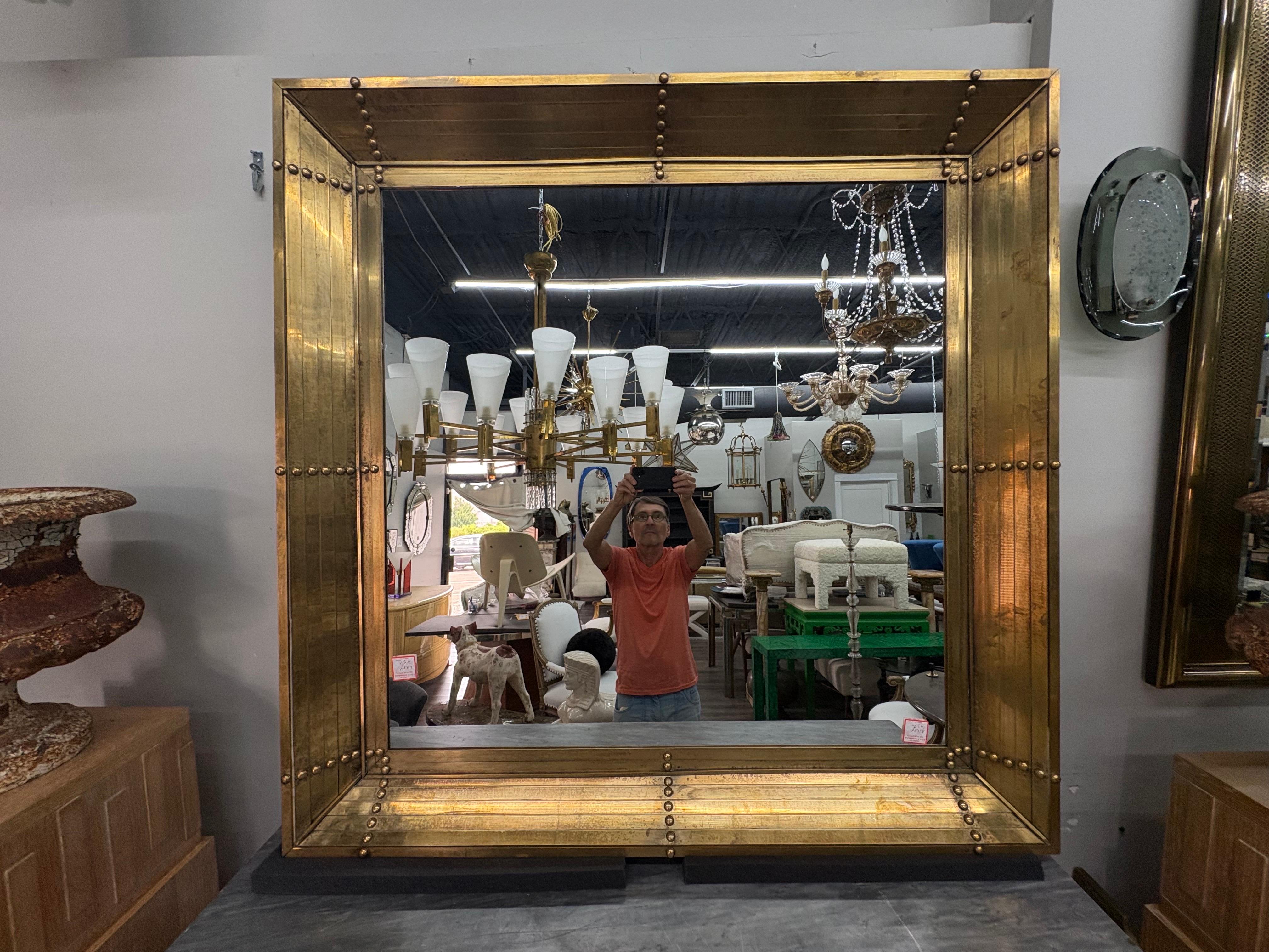 Pair Of Large Italian Modern Square Bronze Mirrors.
Offered is an outstanding pair of Italian mid century modern Gio Ponti inspired bronze heavy weight bronze mirrors with a beautifully detailed design.
This gorgeous pair of Italian bronze square