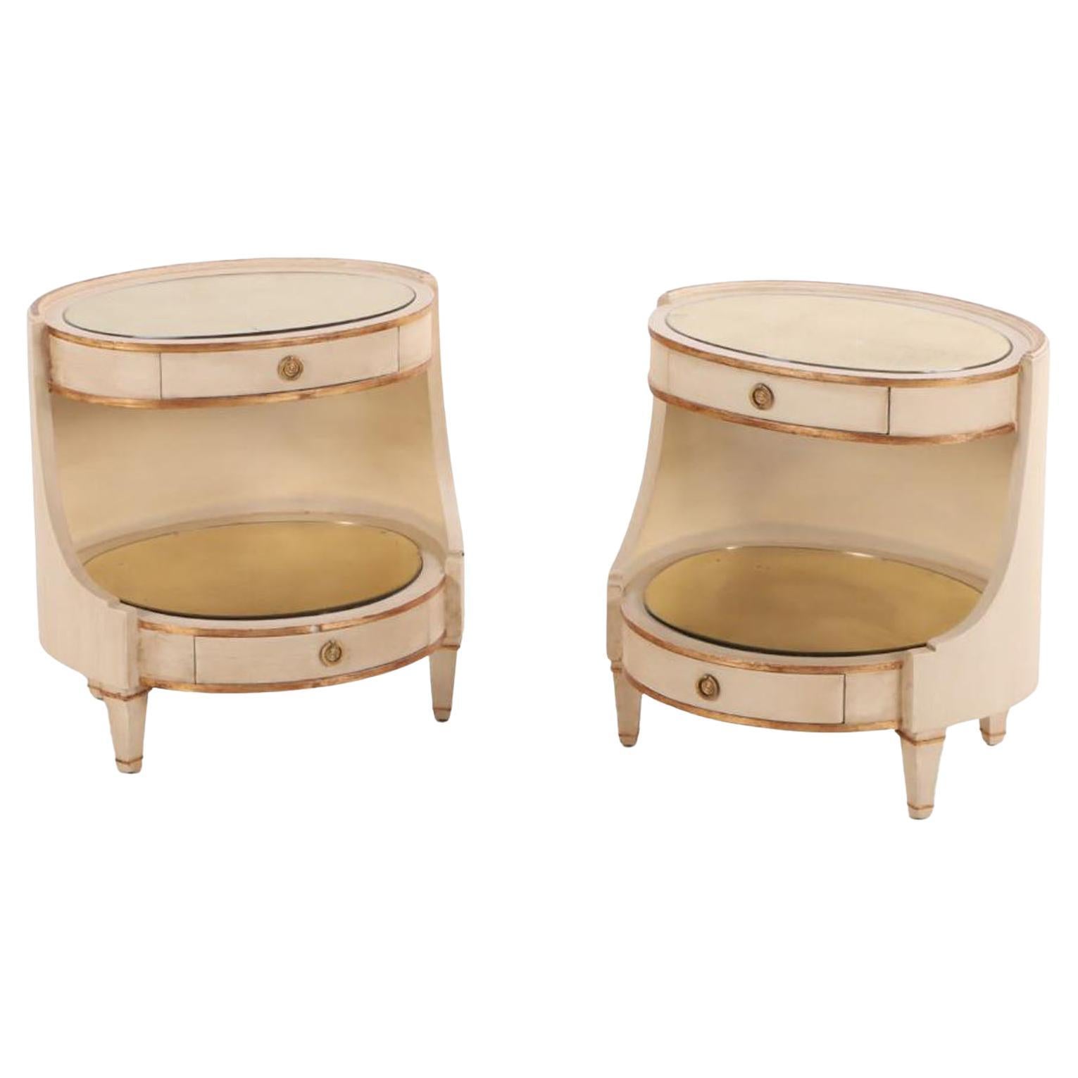 Pair of large Italian painted and giltwood oval nightstands, C 1950.