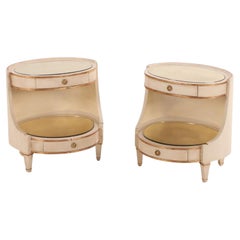 Pair of large Italian painted and giltwood oval nightstands, C 1950.