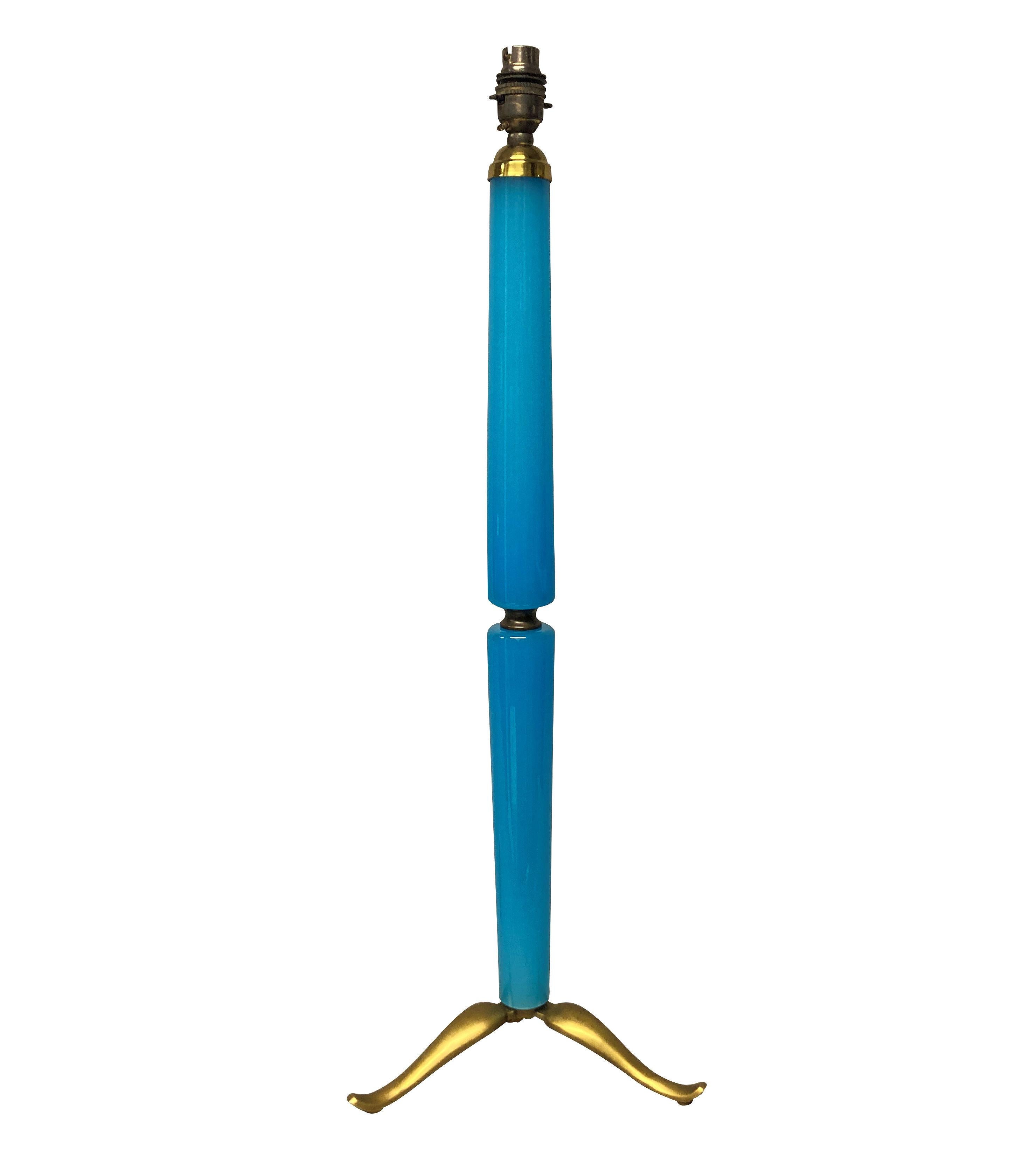 A pair of large Italian pale blue vaseline glass table lamps, with gilt brass tripod feet.