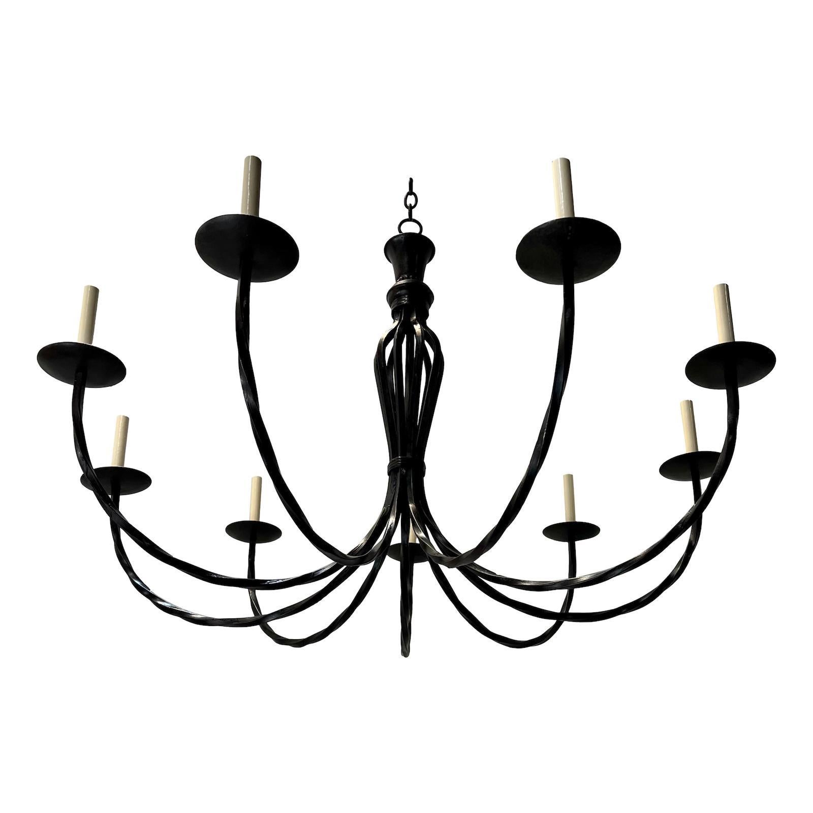 An Italian nine-arm wrought iron chandeliers. Sold individually.

Measurements:
Drop: 36