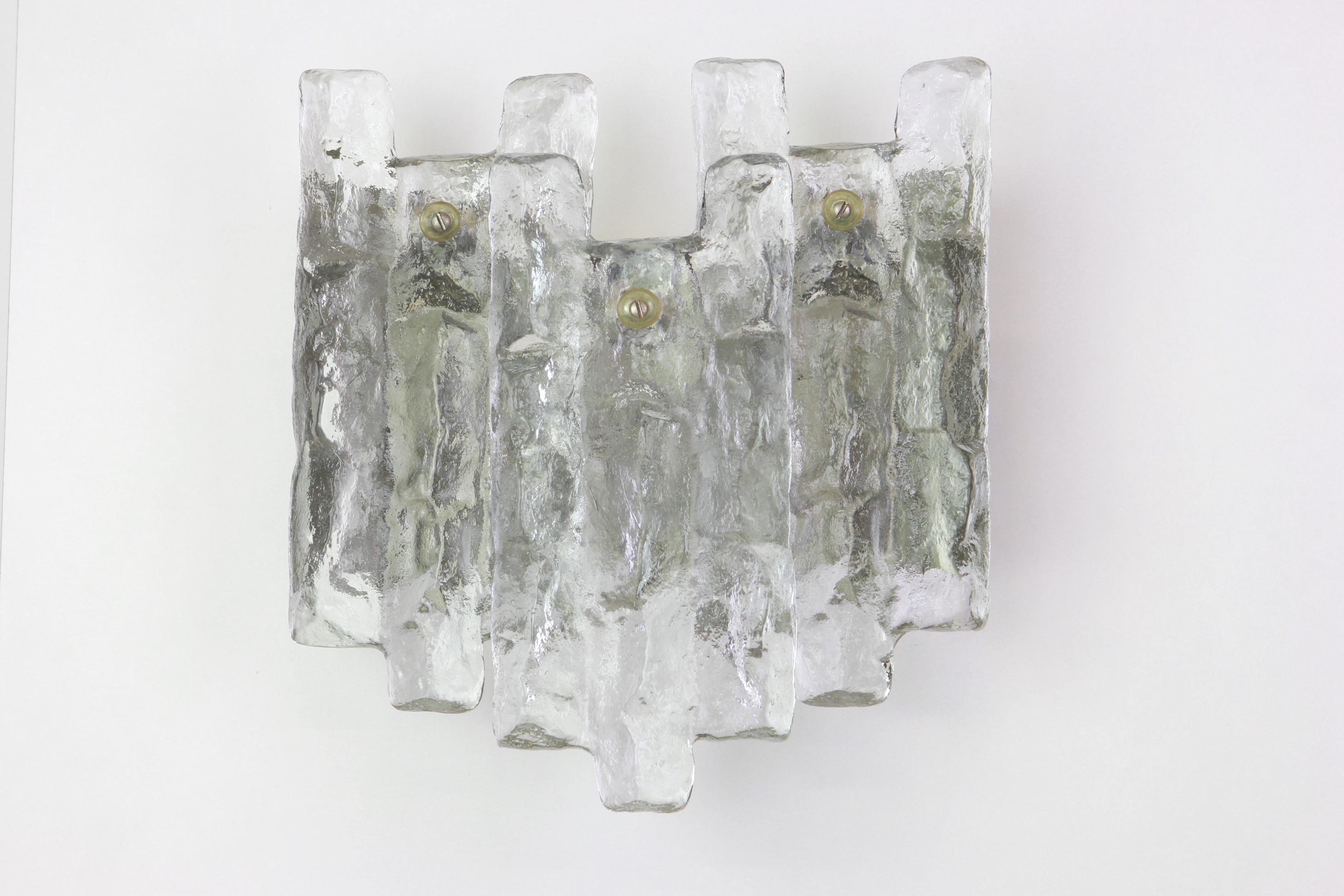 Wonderful pair of midcentury wall sconces with three large Murano glass pieces in each lamp, made by Kalmar, Austria, manufactured, circa 1960-1969.

High quality and in very good condition. Cleaned, well-wired and ready to use. 

Each sconce