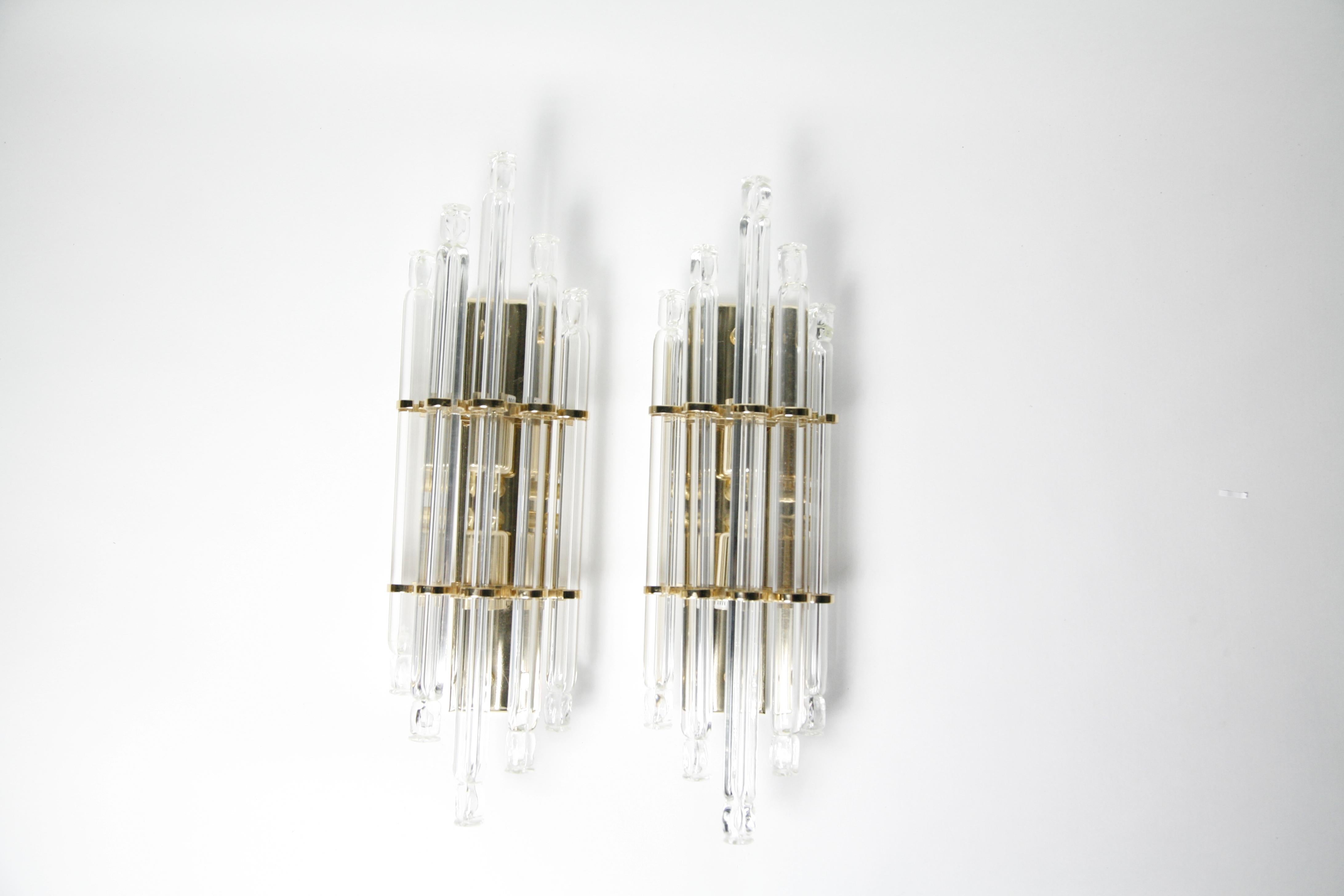 Pair of Kowatz leuchten sconces Germany, 1980, consisting of gilded frames with 5 individual crystal glass rods as a shade, elegant look.
Nicely detailed with tiny gold turn switch.
Hold two candelabra bulbs each, rewired for the US.

Priced as