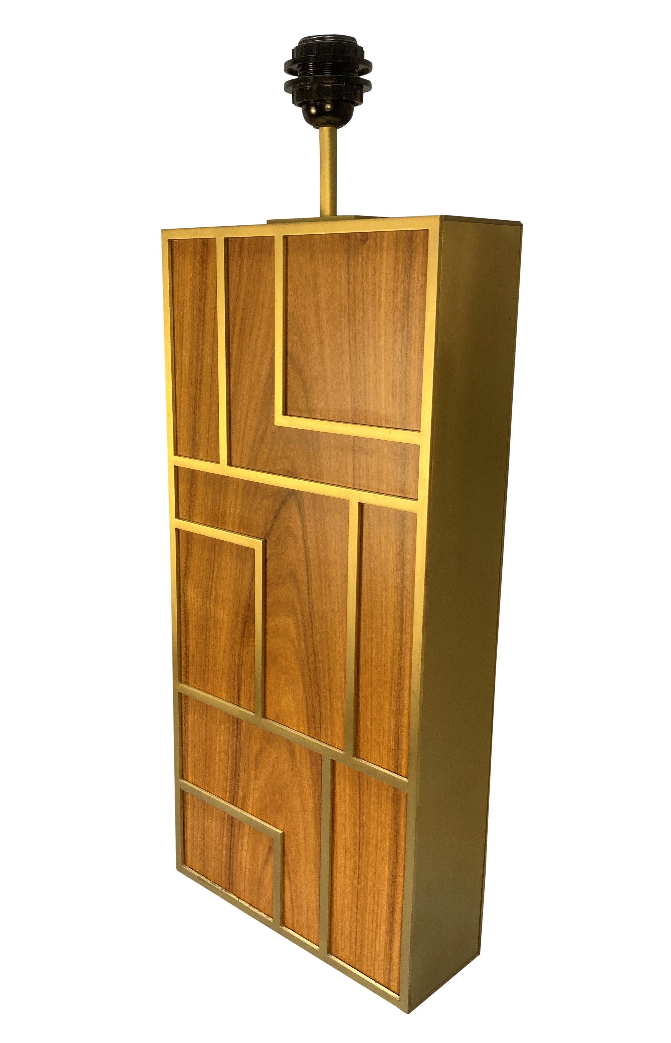 A pair of large Continental teak and brushed brass Modernist table lamps. Of good quality and weight.