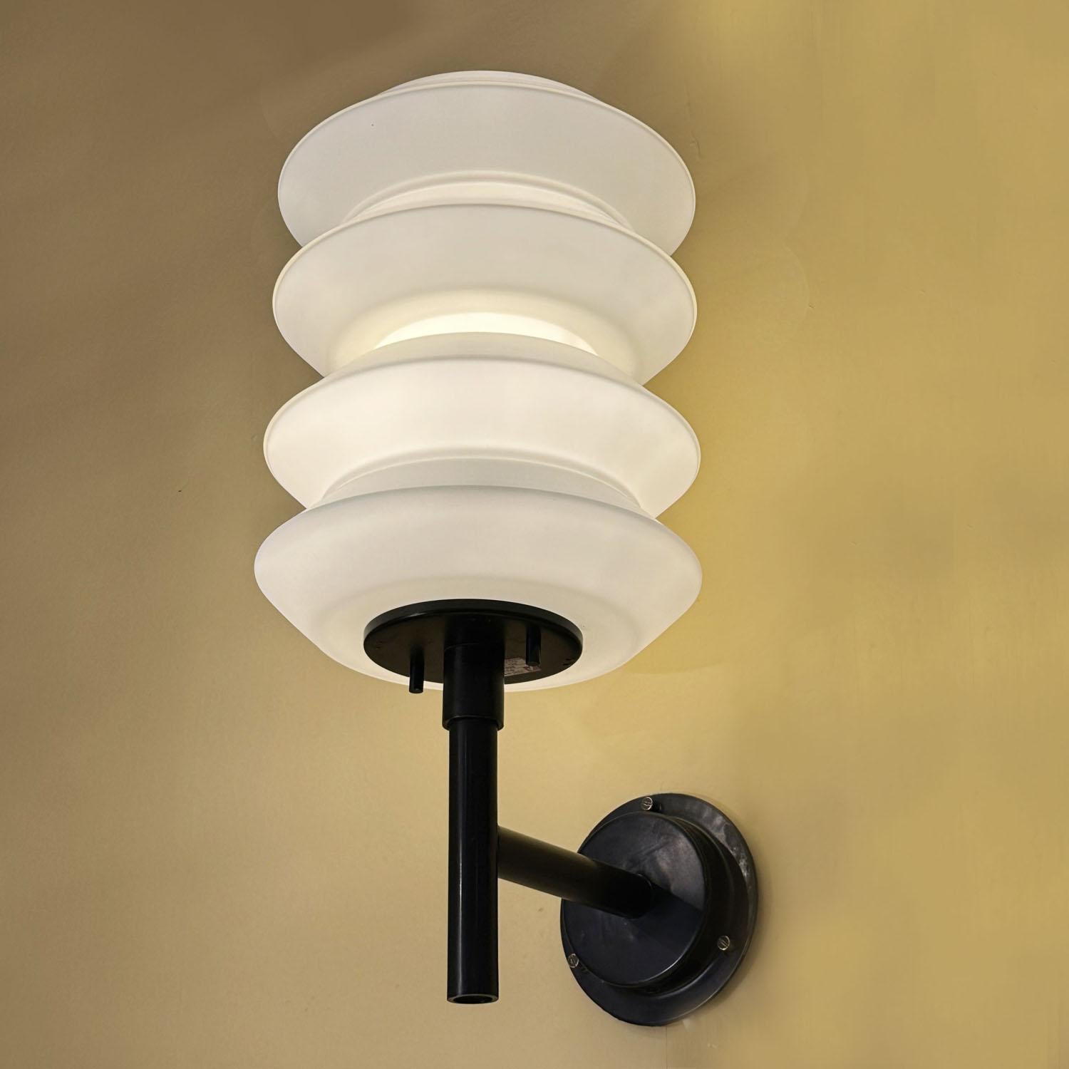 Rare large Lanterns, wall lamps opaline glass shades hold by a black metal frame., attributed to Raak, Holland circa 1960's. The lamps are Inspired by traditional Japanese rice paper lanterns and are in the style of Stilnovo1960's lighting. The