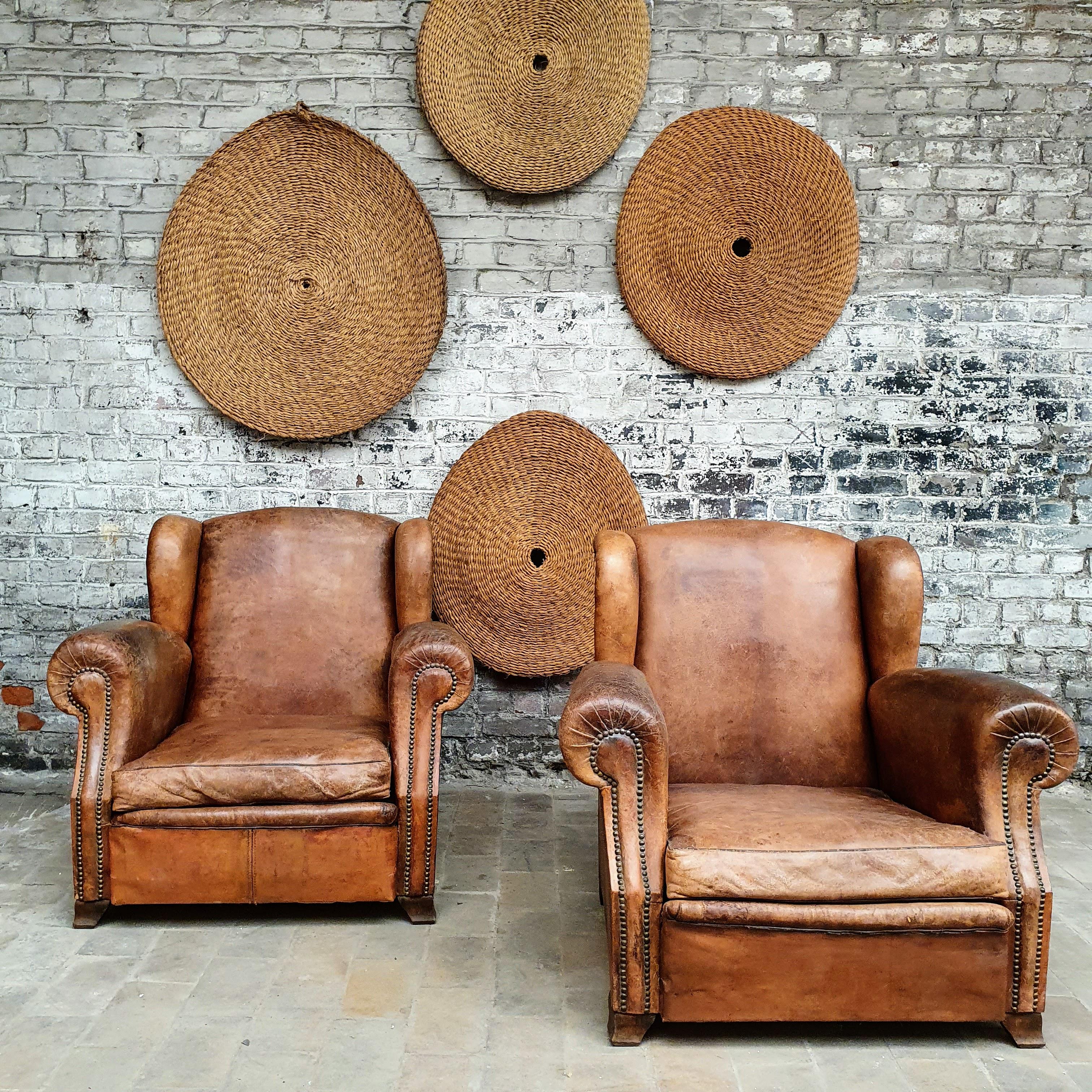 1930 comfortable Havana-colored leather club armchairs.
Restored.