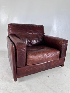 Pair of large leather Roche Bobois armchairs