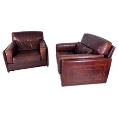 Pair of large leather Roche Bobois armchairs
