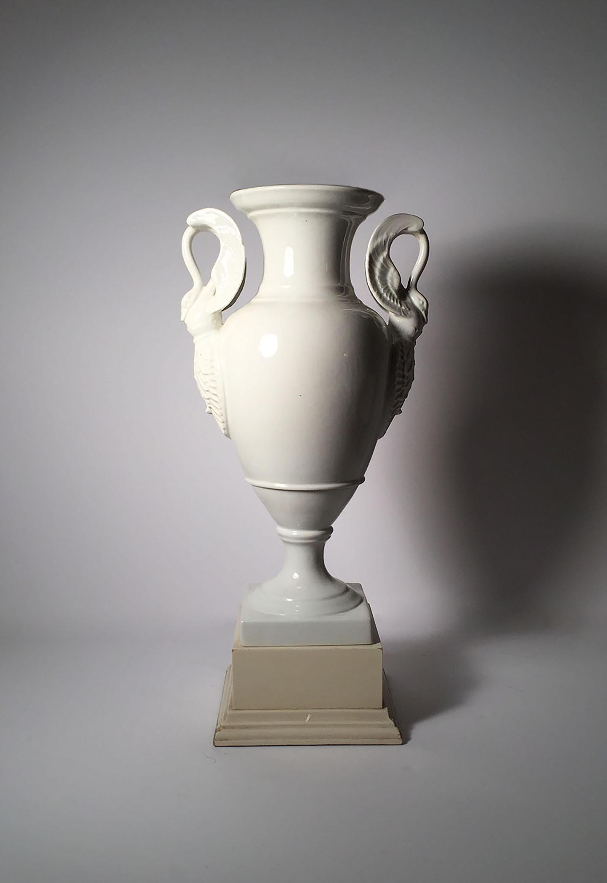 Early 20th century white porcelain Limoges lamp (bases). Swan form handles on a neoclassical urn shaped vase.

Limoge mark on underside of each. Uncertain to when this mark was used. I believe mid-20th century.

Shades Not included. These require