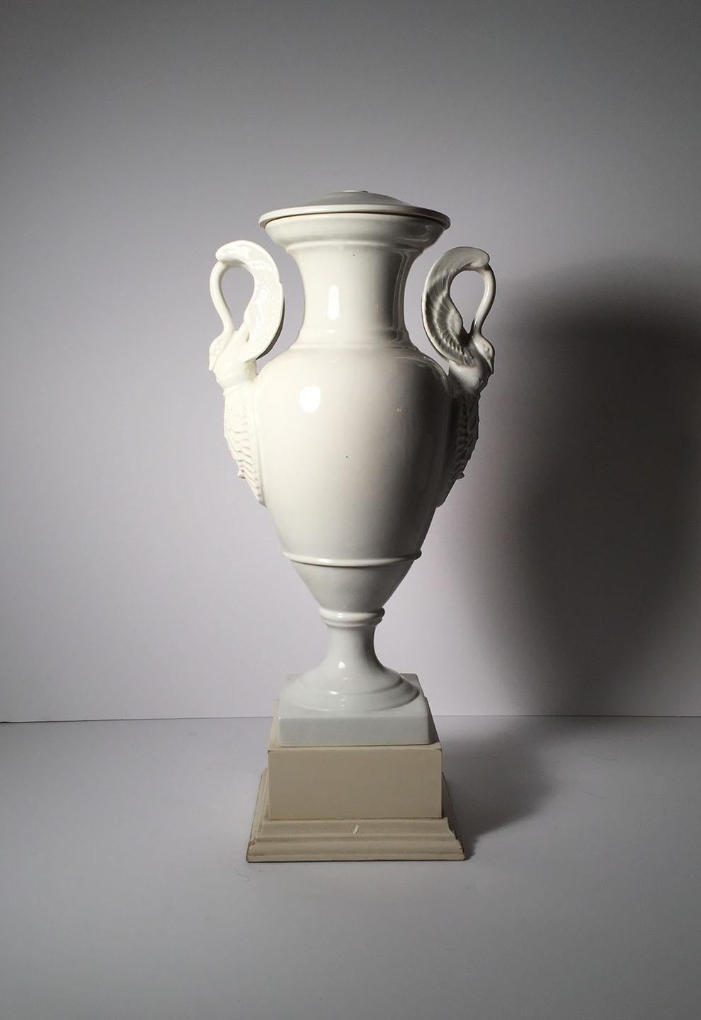 Early 20th century white porcelain Limoges lamp. Swan form handles on a neoclassical urn shaped vase.

Limoge mark on underside of each. Uncertain to when this mark was used. I believe mid-20th century.