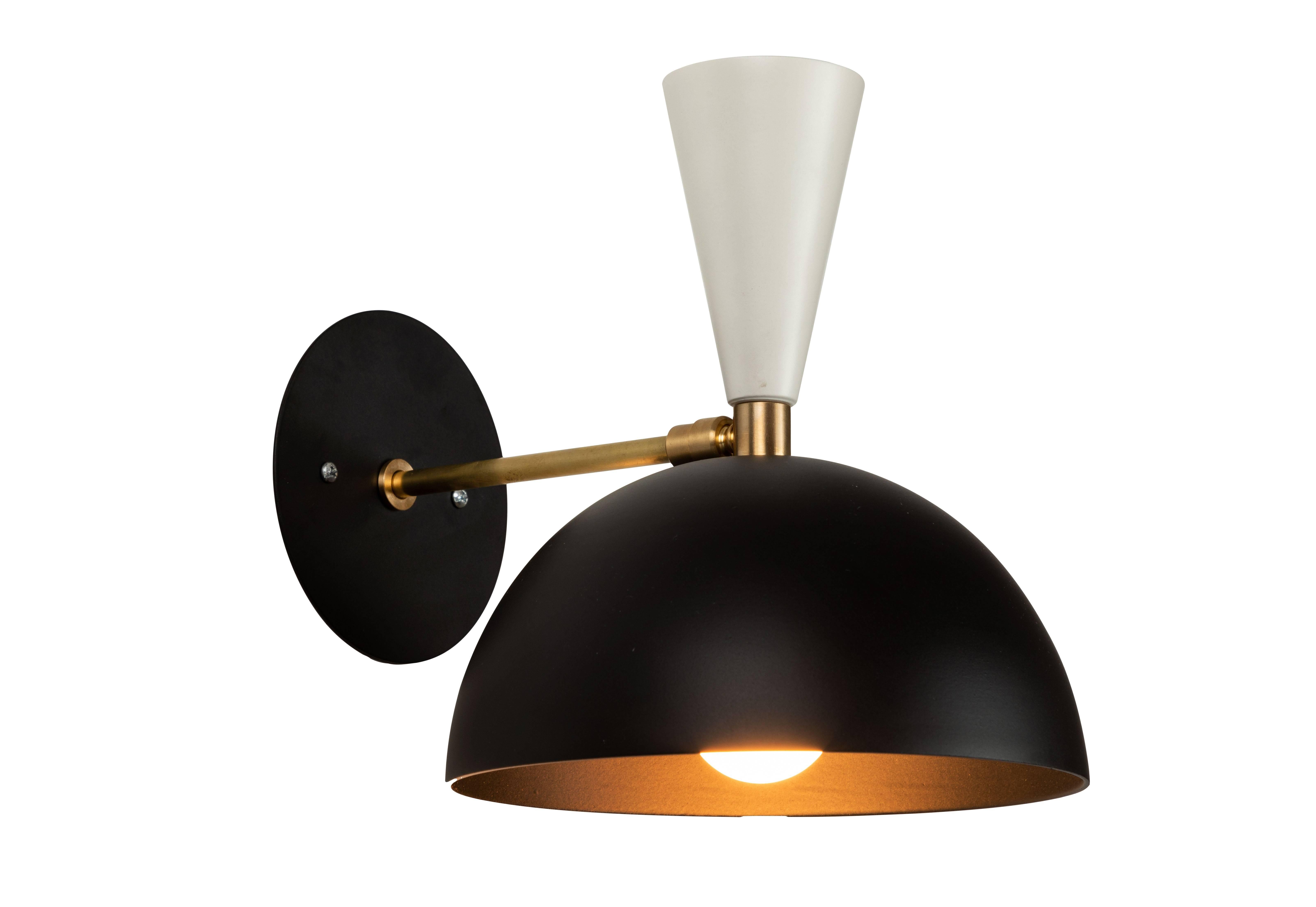 Pair of 'Lola' brass and metal adjustable sconces in black and white. 

Hand-fabricated by Los Angeles based designer and lighting professional Alvaro Benitez, these highly refined sconces are reminiscent of the iconic midcentury Italian designs of
