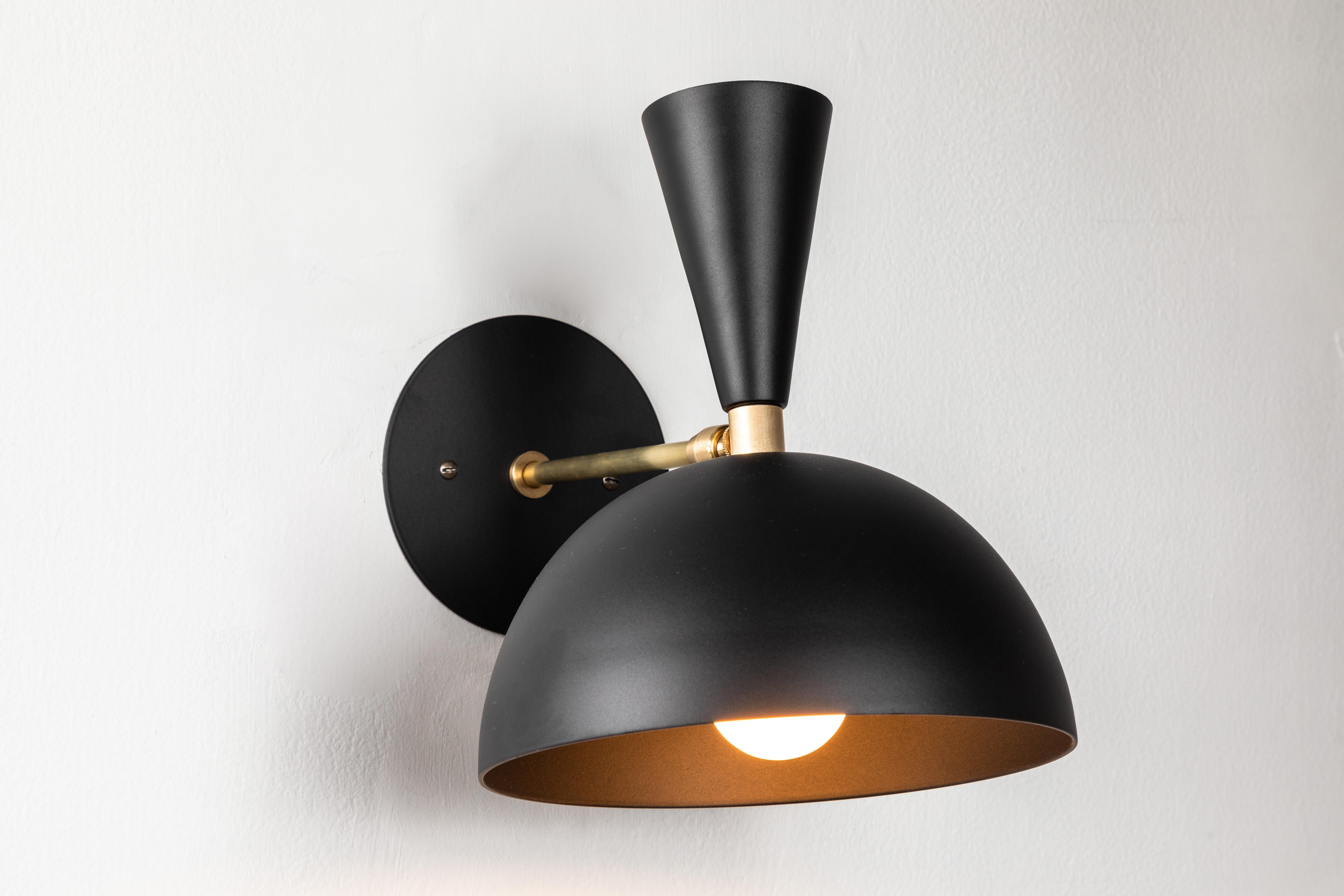 Pair of large 'Lola II' sconces in black. Hand-fabricated by Los Angeles based designer and lighting professional Alvaro Benitez, these highly refined sconces are reminiscent of the iconic midcentury Italian designs of Arteluce and Stilnovo.