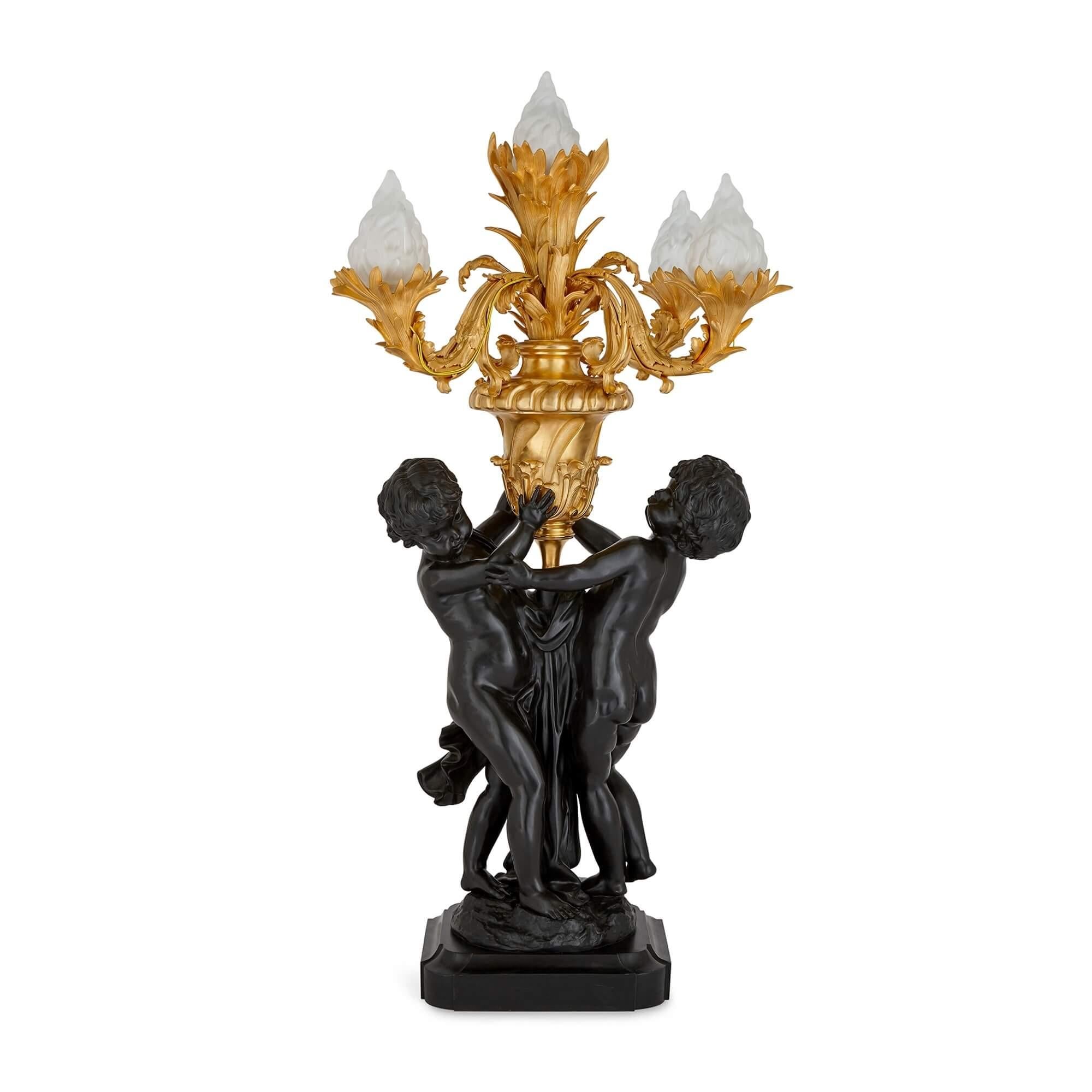 Pair of large Louis XVI style gilt and patinated bronze cherub candelabra
French, 20th century
Height: 147cm, width: 69cm, depth: 69cm

Impressive in size and exceptional in the quality of their execution, these excellent candelabra are made in