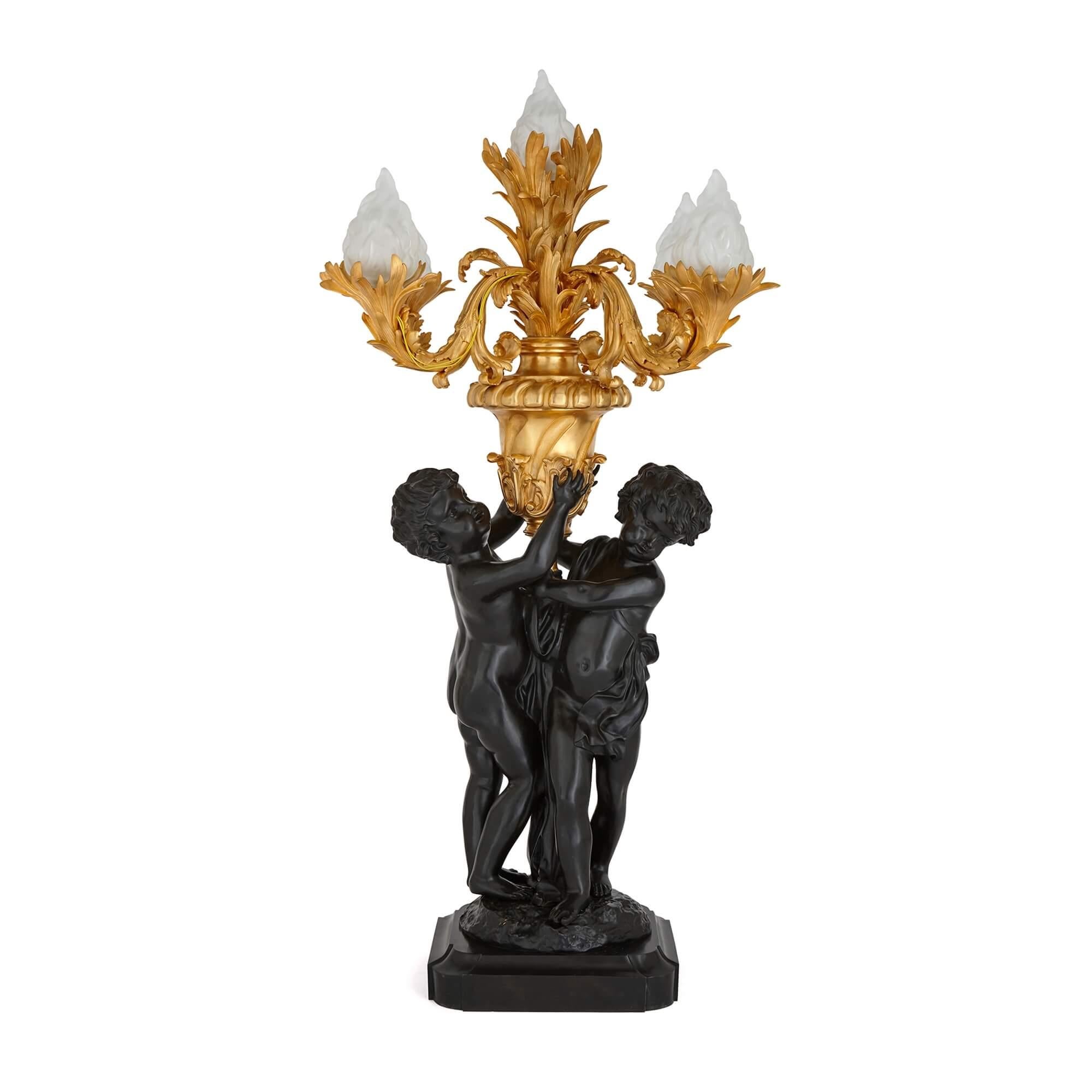 French Pair of Large Louis XVI Style Gilt and Patinated Bronze Cherub Candelabra For Sale
