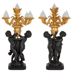 Pair of Large Louis XVI Style Gilt and Patinated Bronze Cherub Candelabra