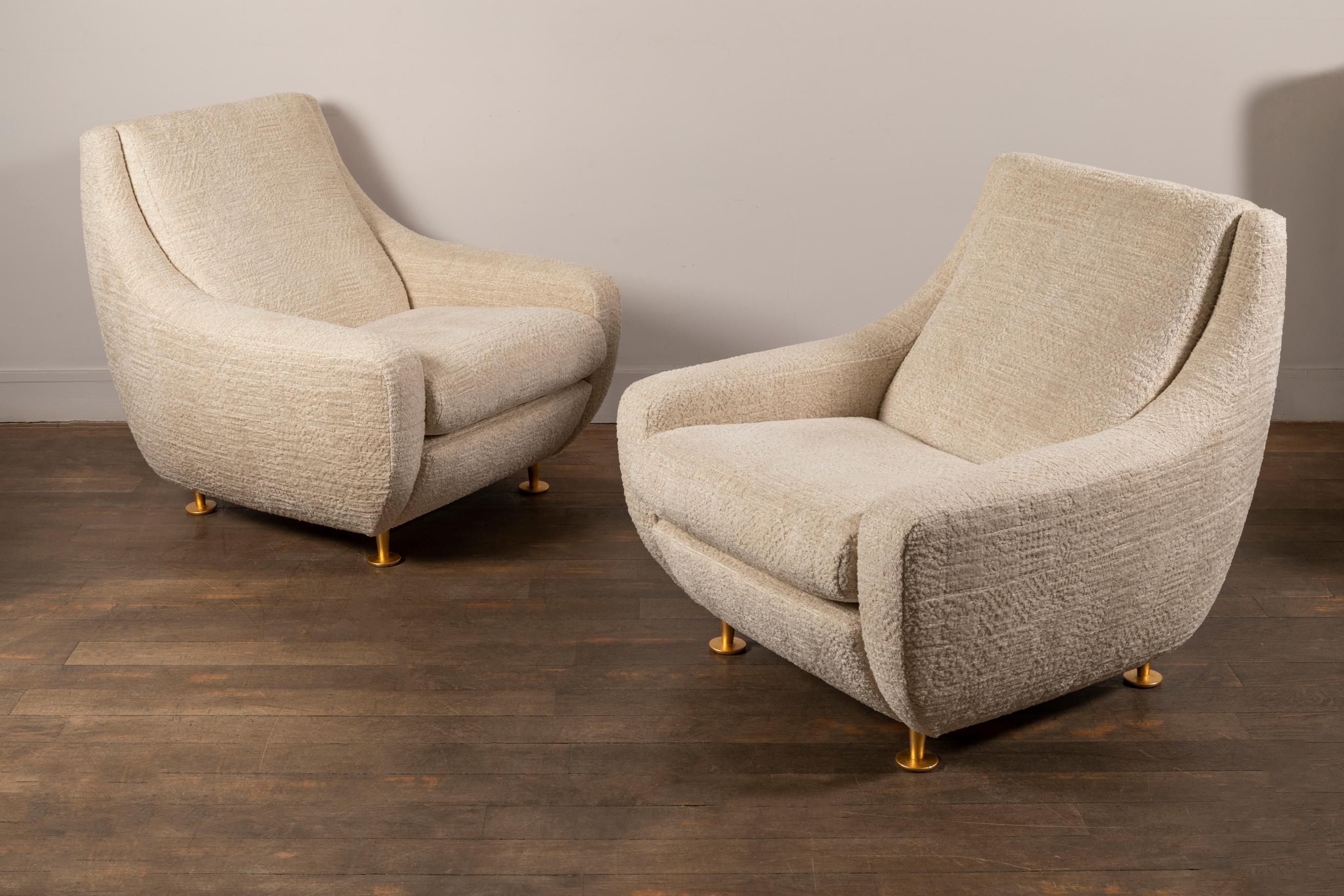 Pair of lounge chairs
In the style of Marco Zanuso
gilded metal feet . 
Italy, 1950s

Newly re-upholstered in Nobilis fabric
Measures: Height 82 cm, 32.3 in.
Width 87 cm, 43.2 in.
Depth 92 cm, 36.2 in.
Height seat 44 cm, 17.3 in.

 