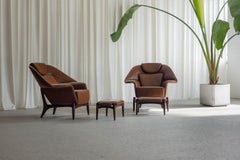 Pair of large lounge chairs with ottomans Italy 1960