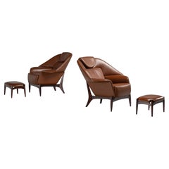 Pair of large lounge chairs with ottomans Italy 1960